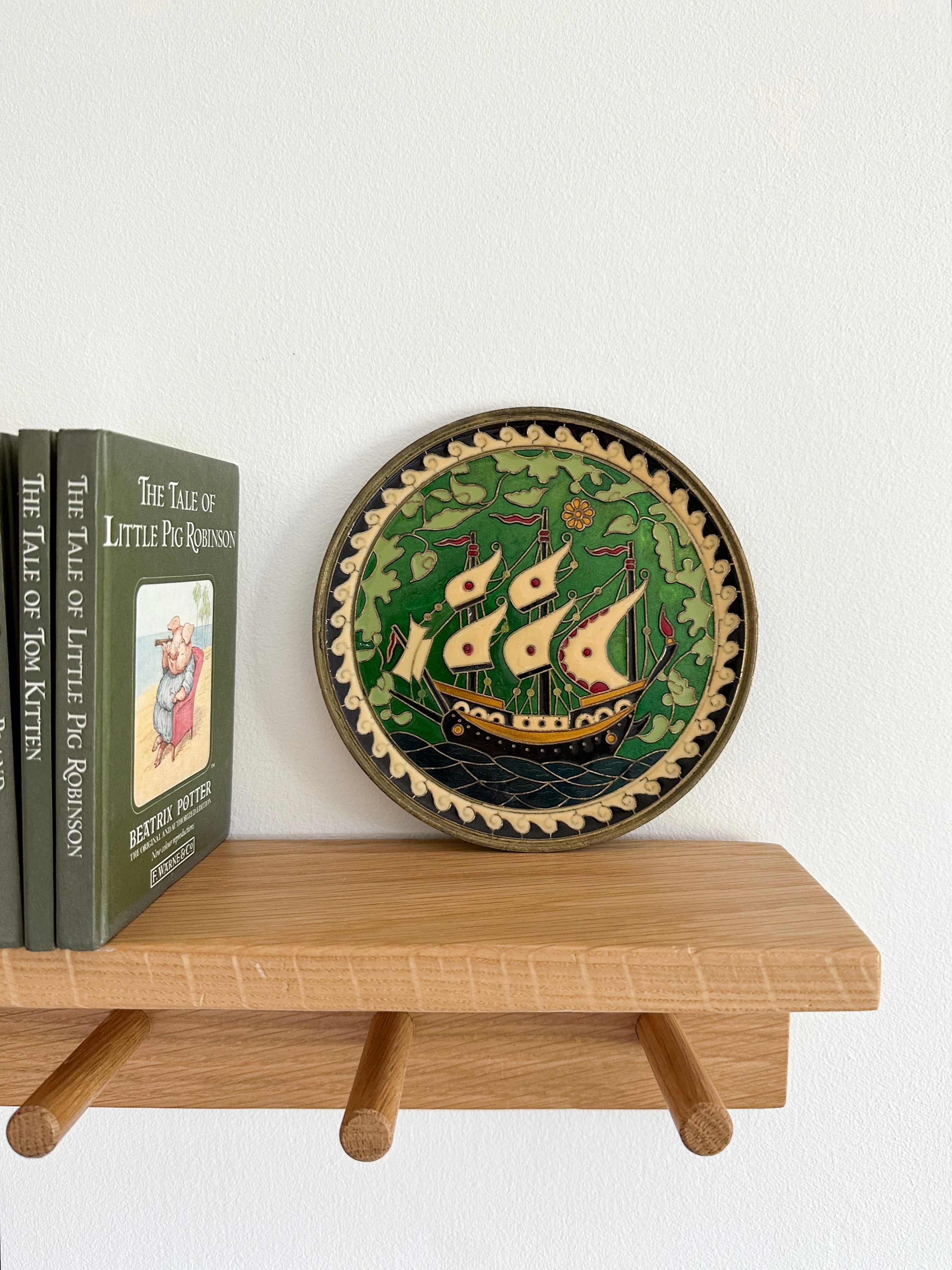 Vintage brass enamelled plate featuring a ship - Moppet
