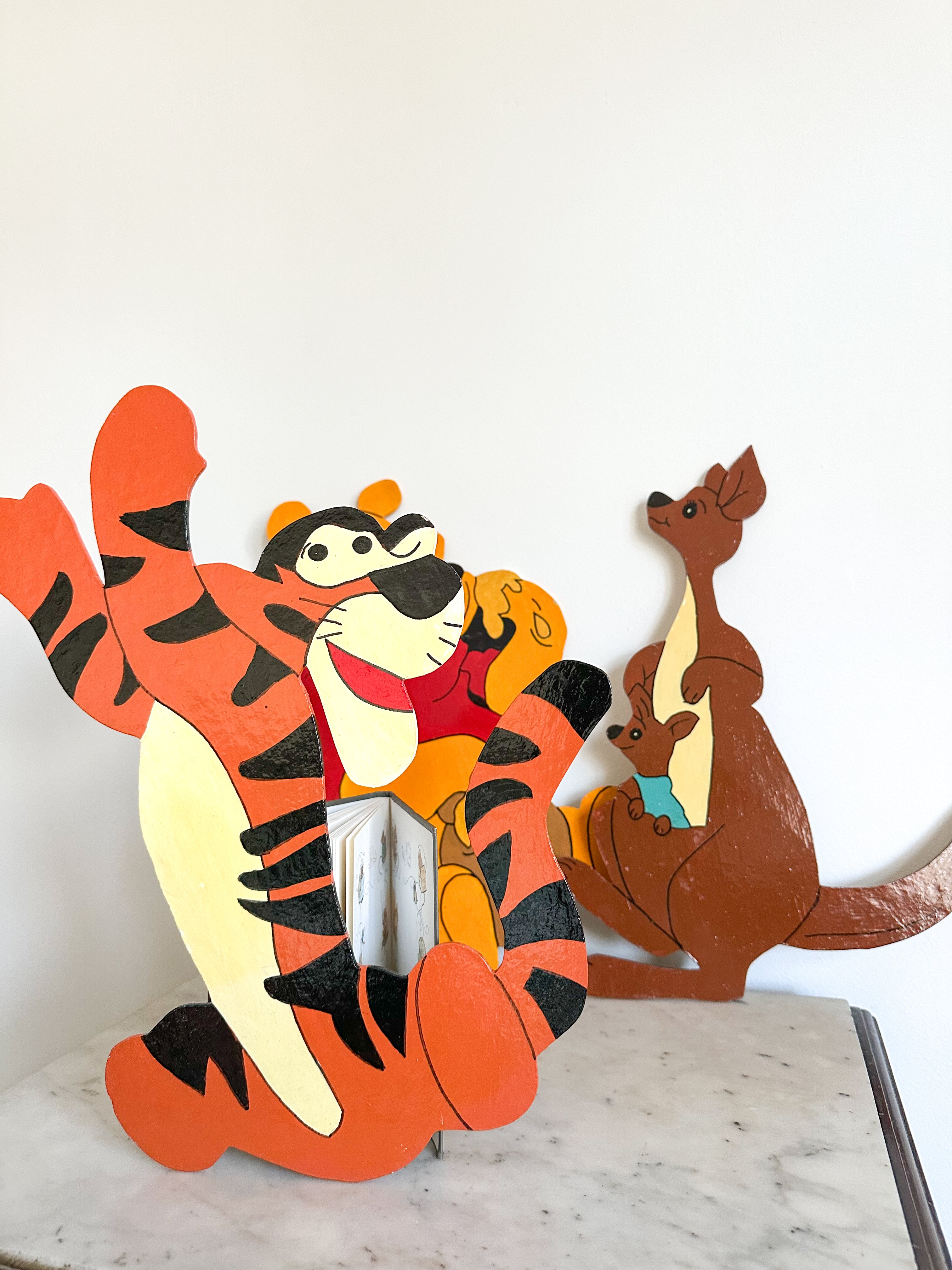 Vintage hand-painted collection of Winnie the Pooh plaques on cut-out board