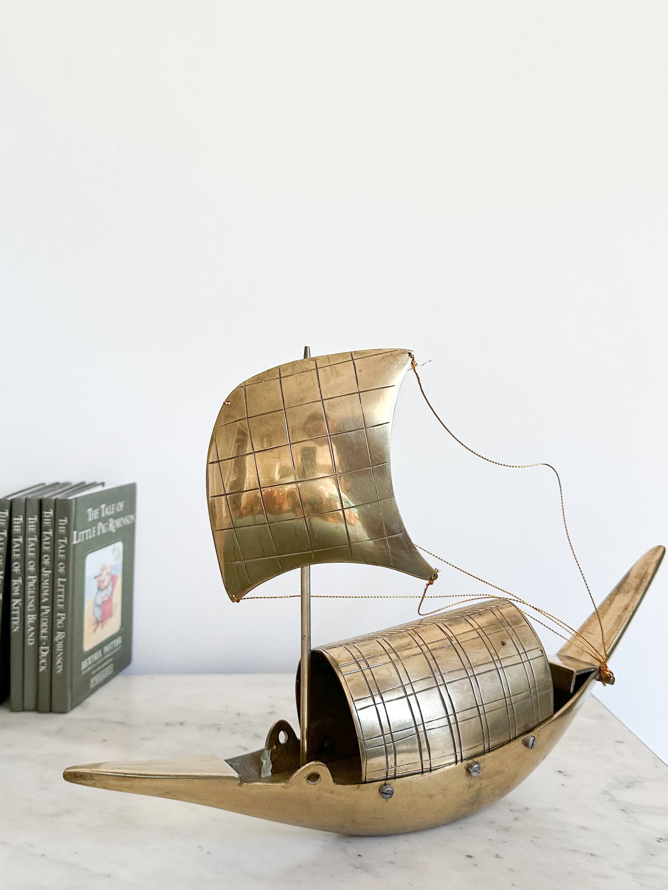 Vintage brass sailing boat