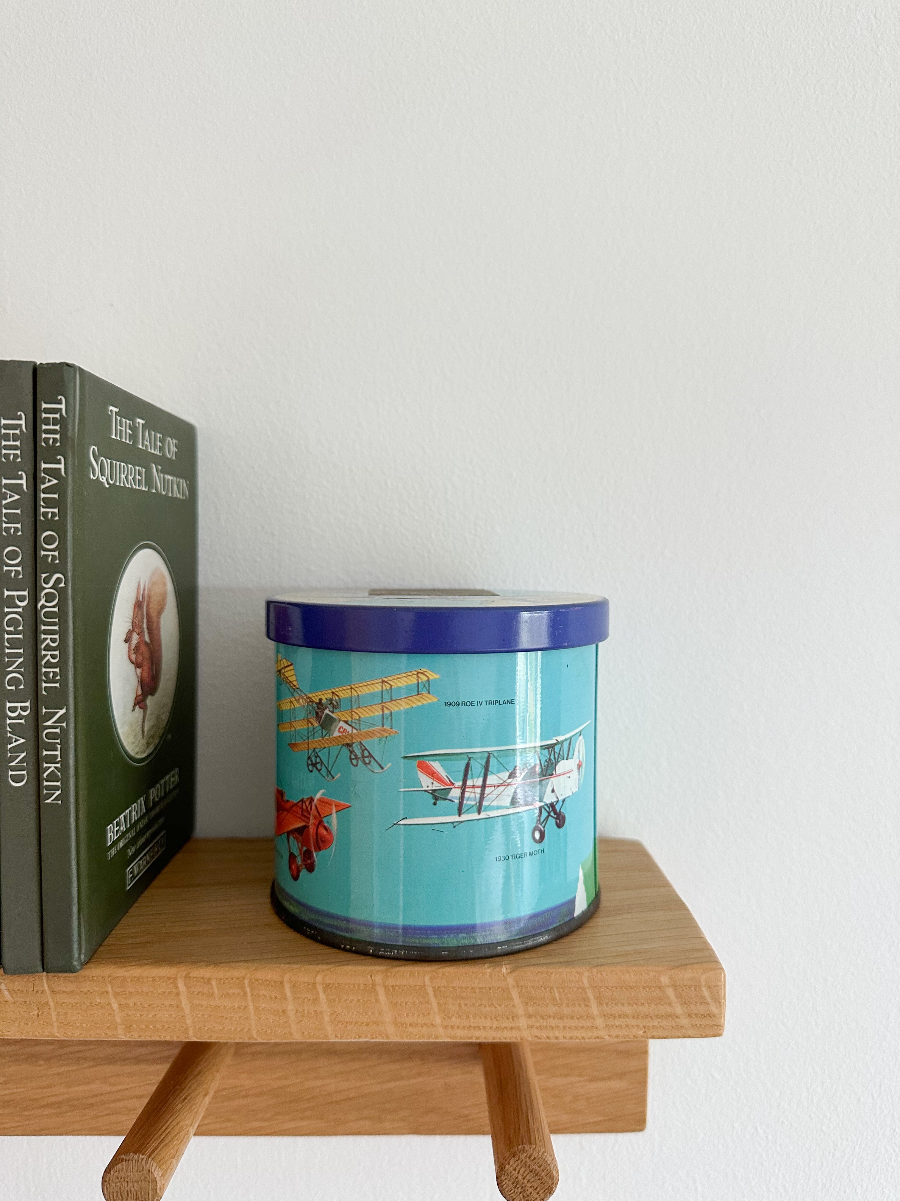 Vintage 1950s children’s illustrated graphic tin feat. aeroplanes, by Bluebird Toffee - Moppet