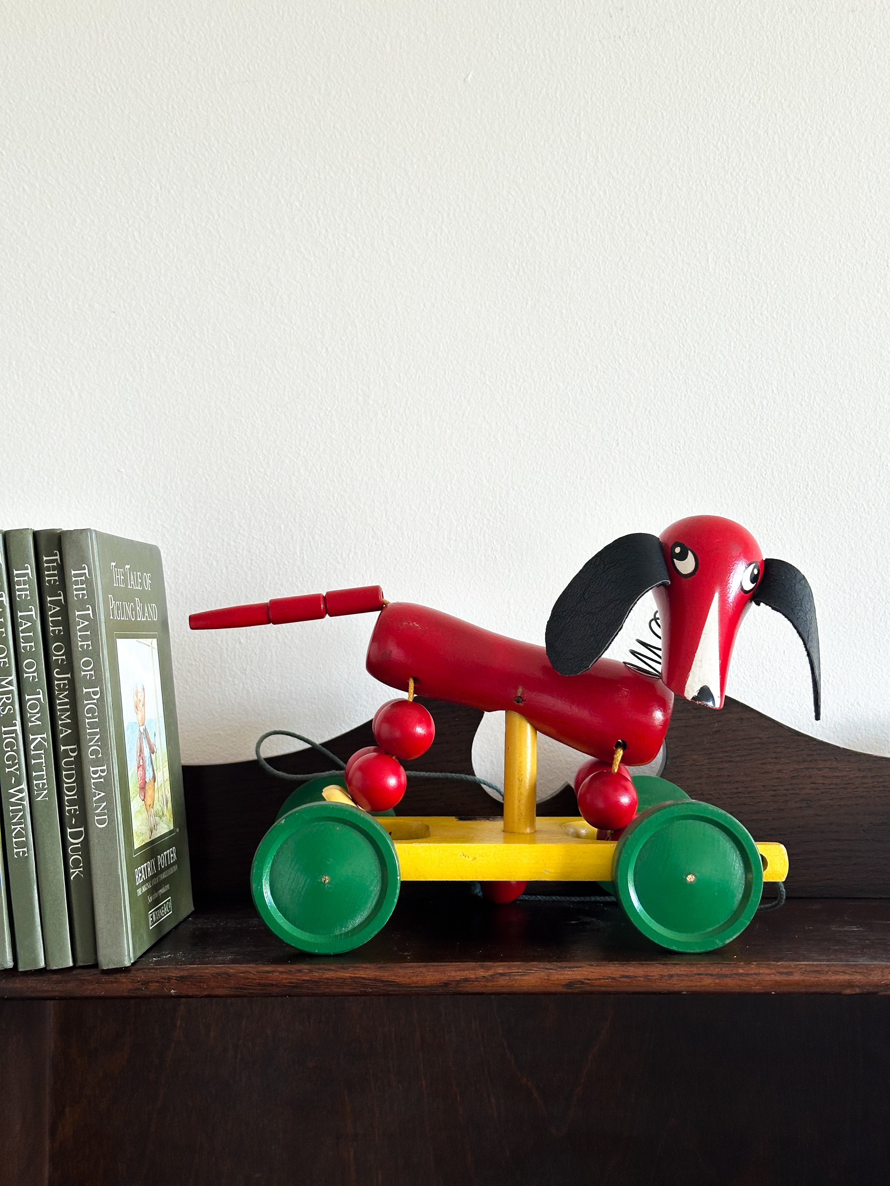 Vintage 1950s Swedish wooden red dachshund sausage dog pull-along toy, by BRIO