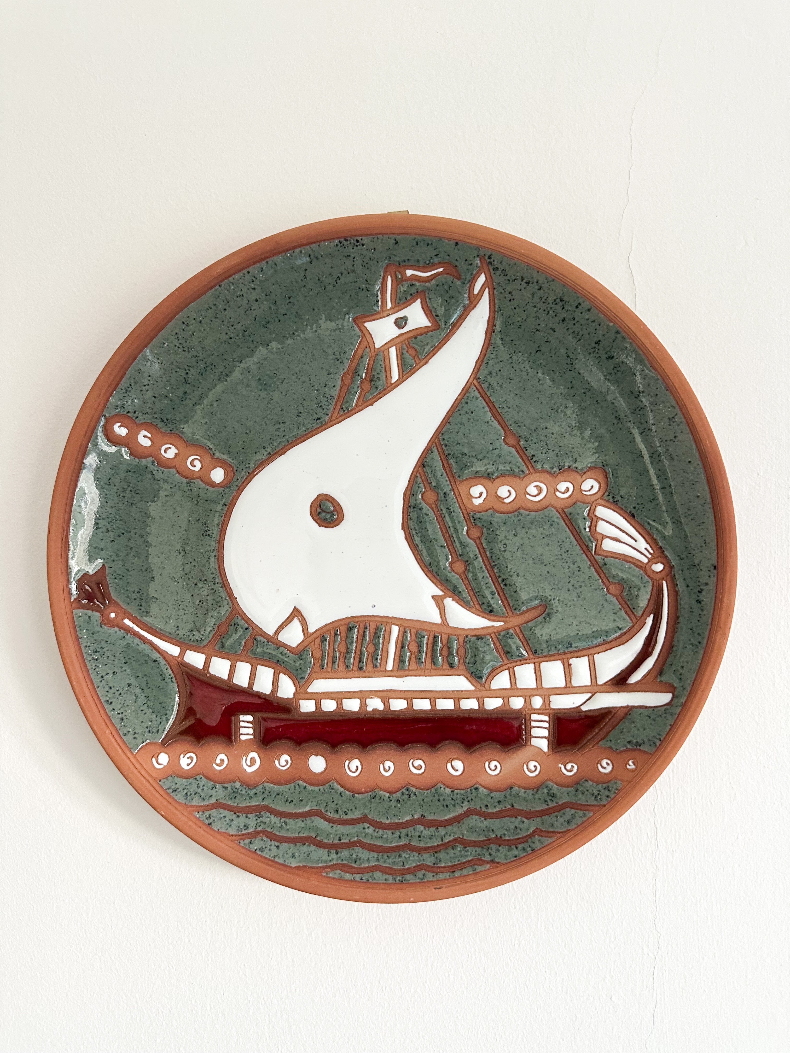 Vintage Greek ceramic hand-painted plate featuring a ship