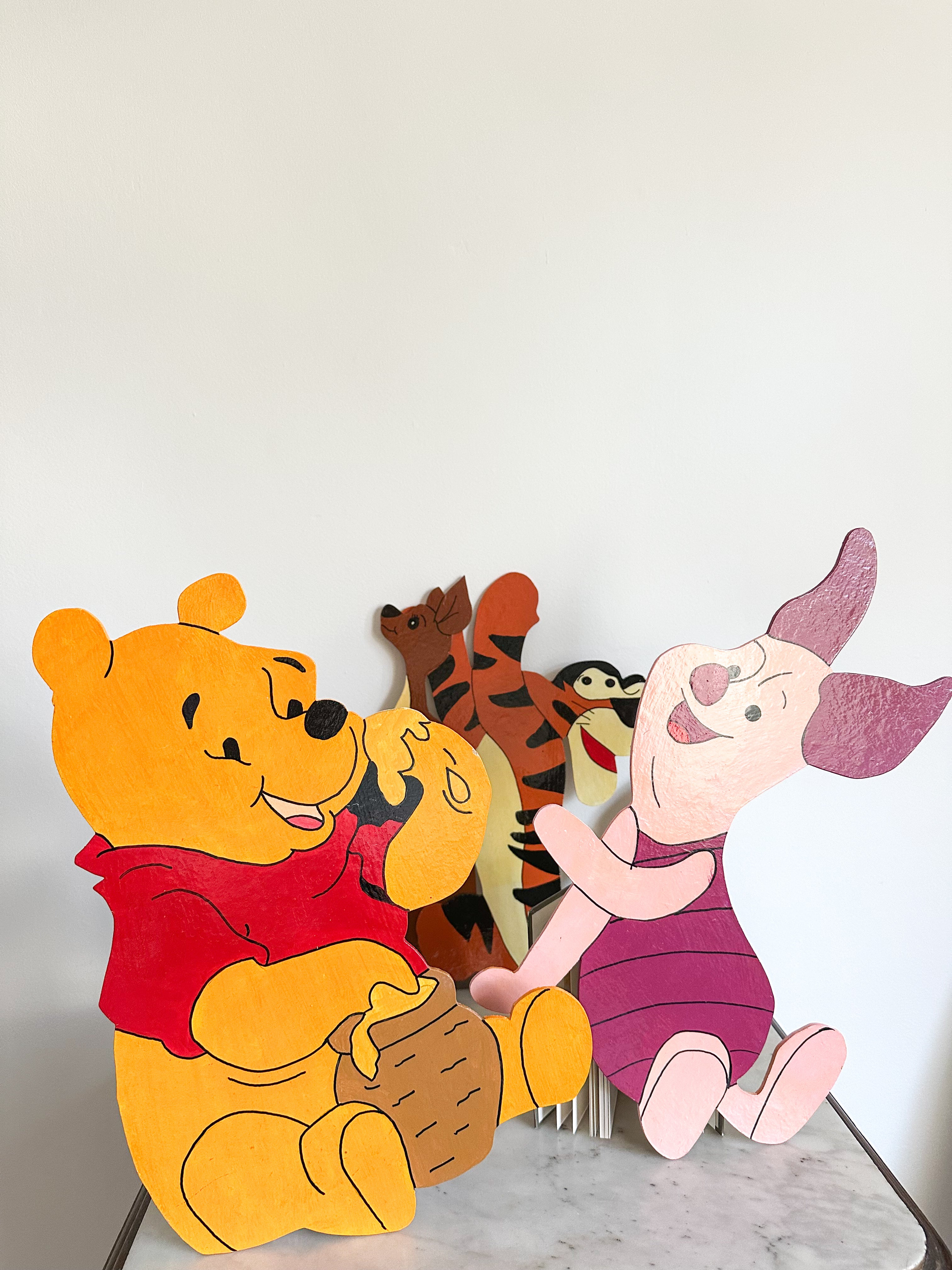 Vintage hand-painted collection of Winnie the Pooh plaques on cut-out board