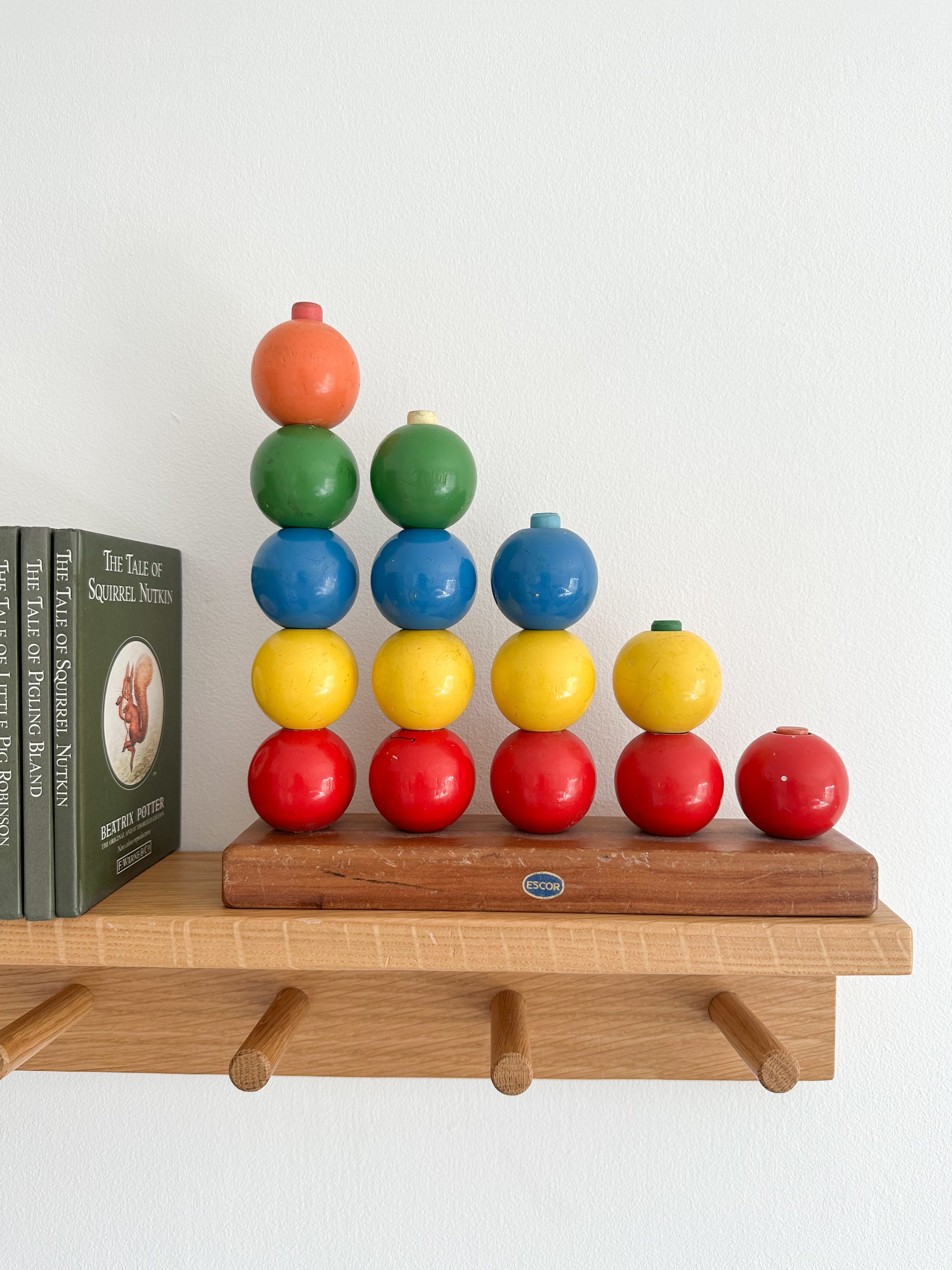 Vintage 1950s Escor stacking counting toy in primary colours, British made - Moppet