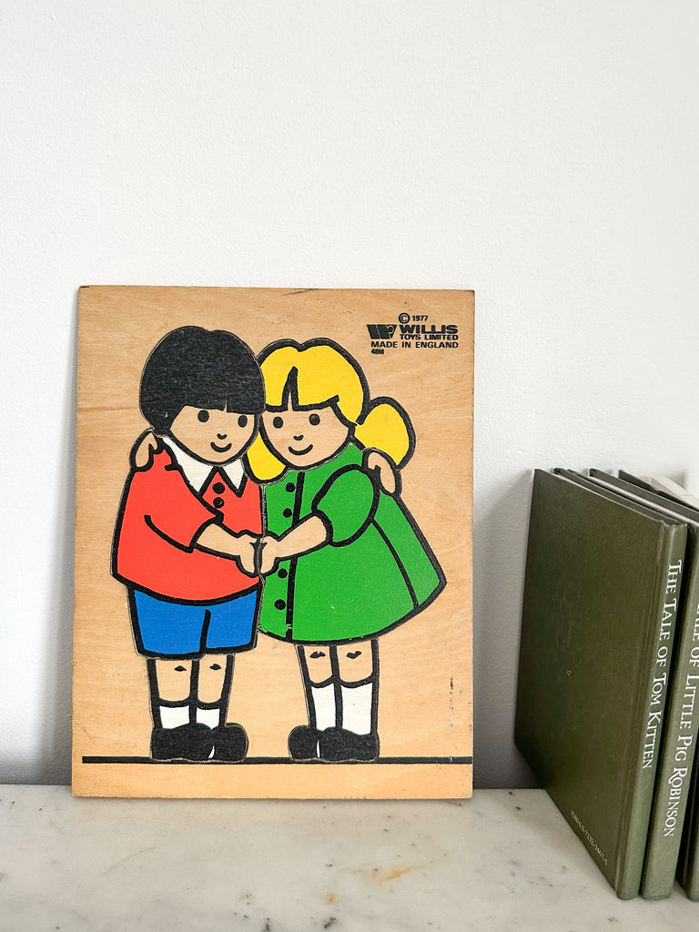 Vintage 1960s wooden puzzle featuring two children hugging, by Willis Toys and illustrated by Dick Bruna, the creator of Miffy - Moppet