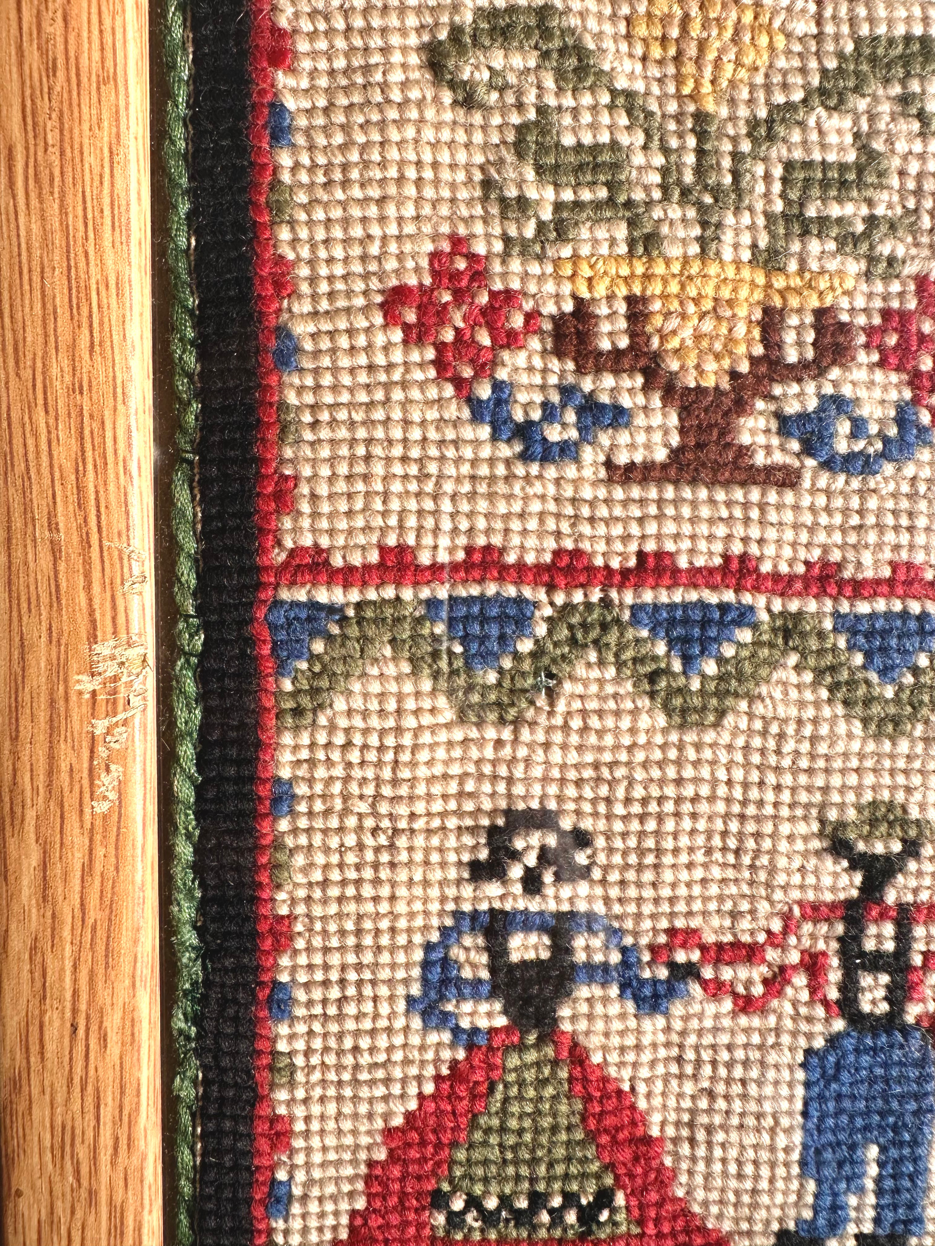Pair of vintage framed embroideries featuring a European folk-art design of a dancing man and woman in traditional dress - Moppet