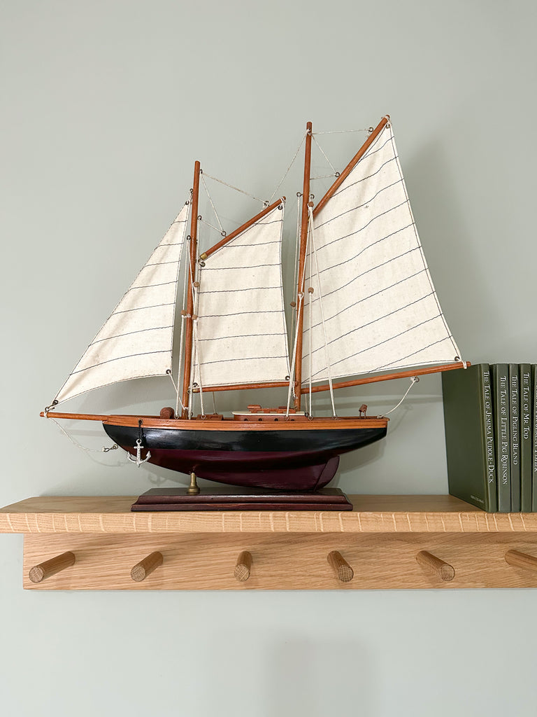 Vintage wooden model sailing boat, yacht or ship with black and burgundy hull - Moppet