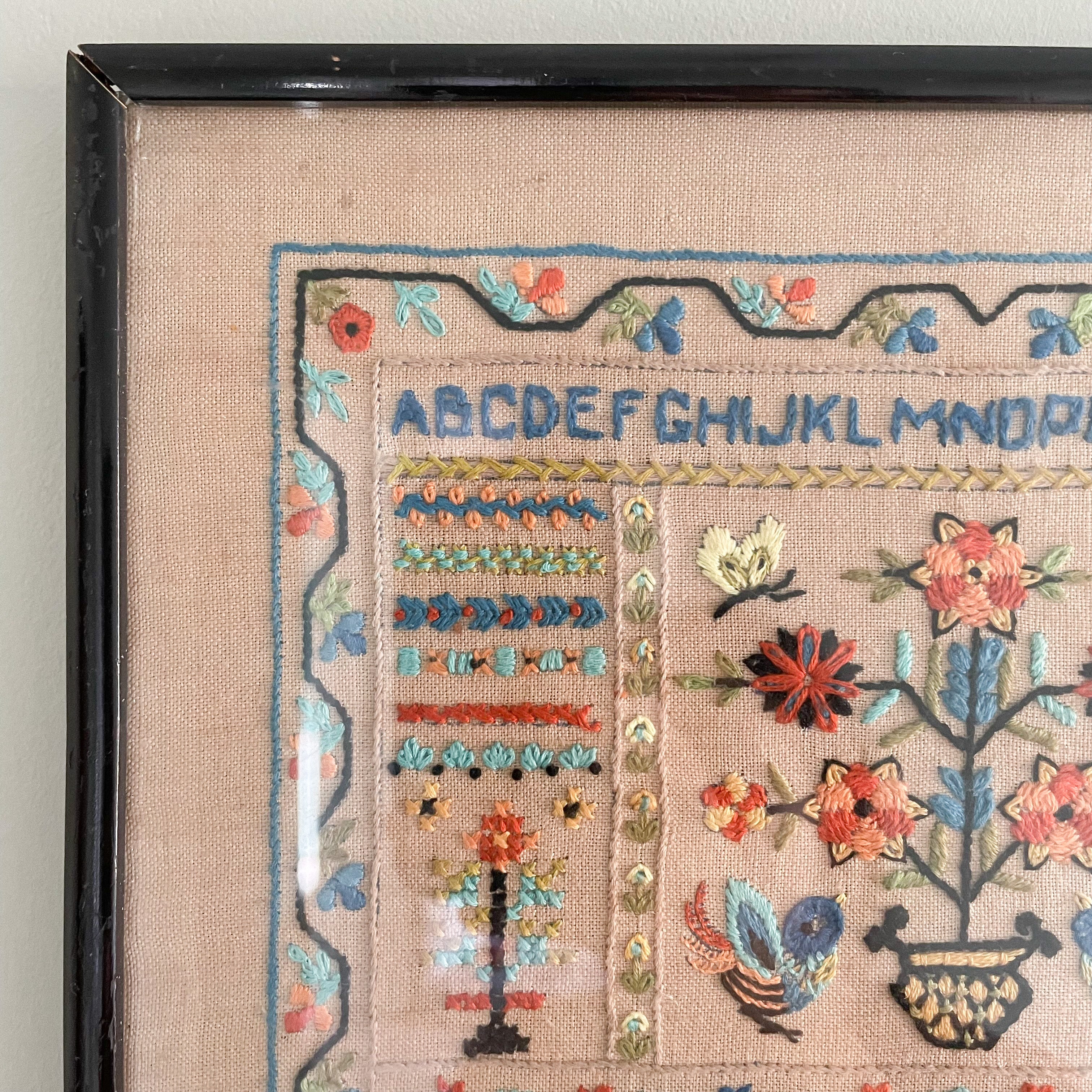 Vintage 1950s framed children's embroidery or needlework alphabet sampler - Moppet