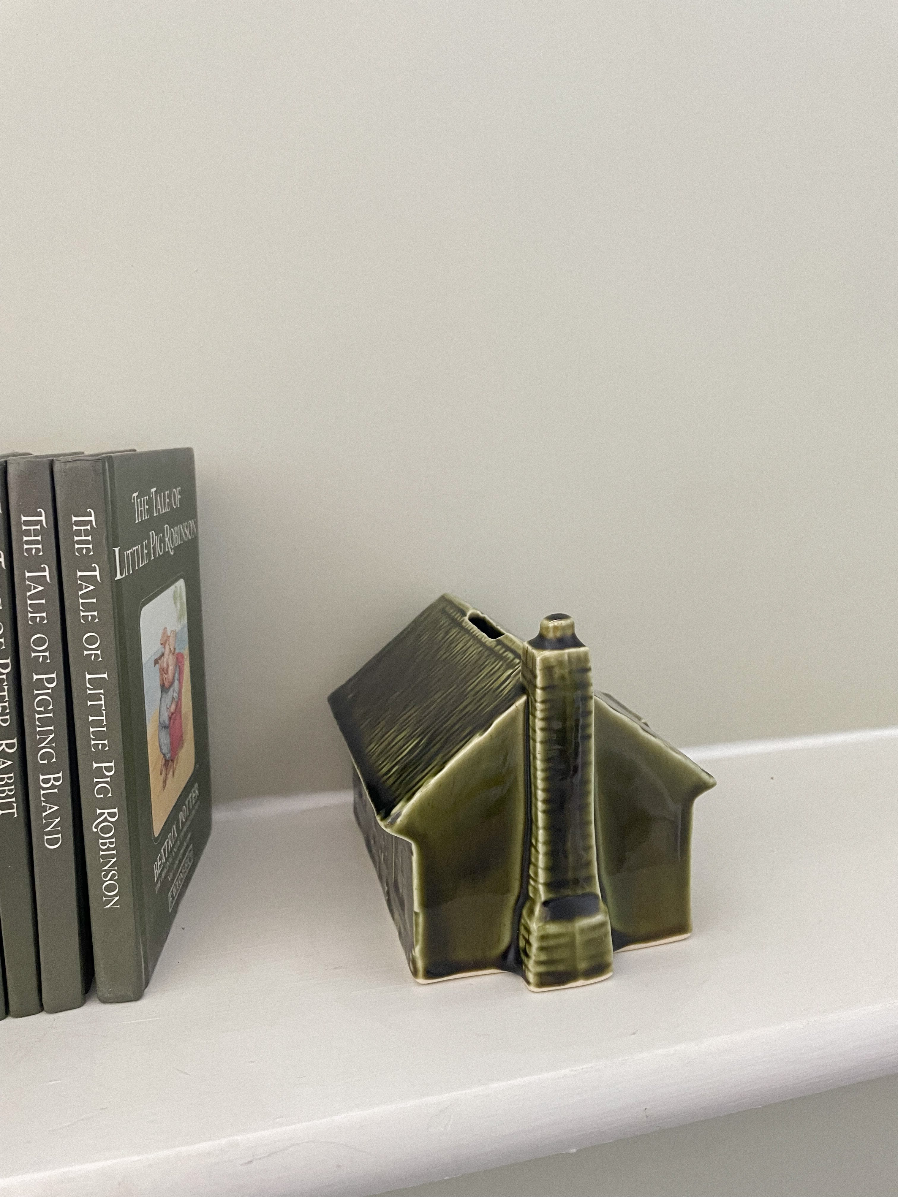 Vintage ceramic house money box in olive green, by Holkham Pottery - Moppet