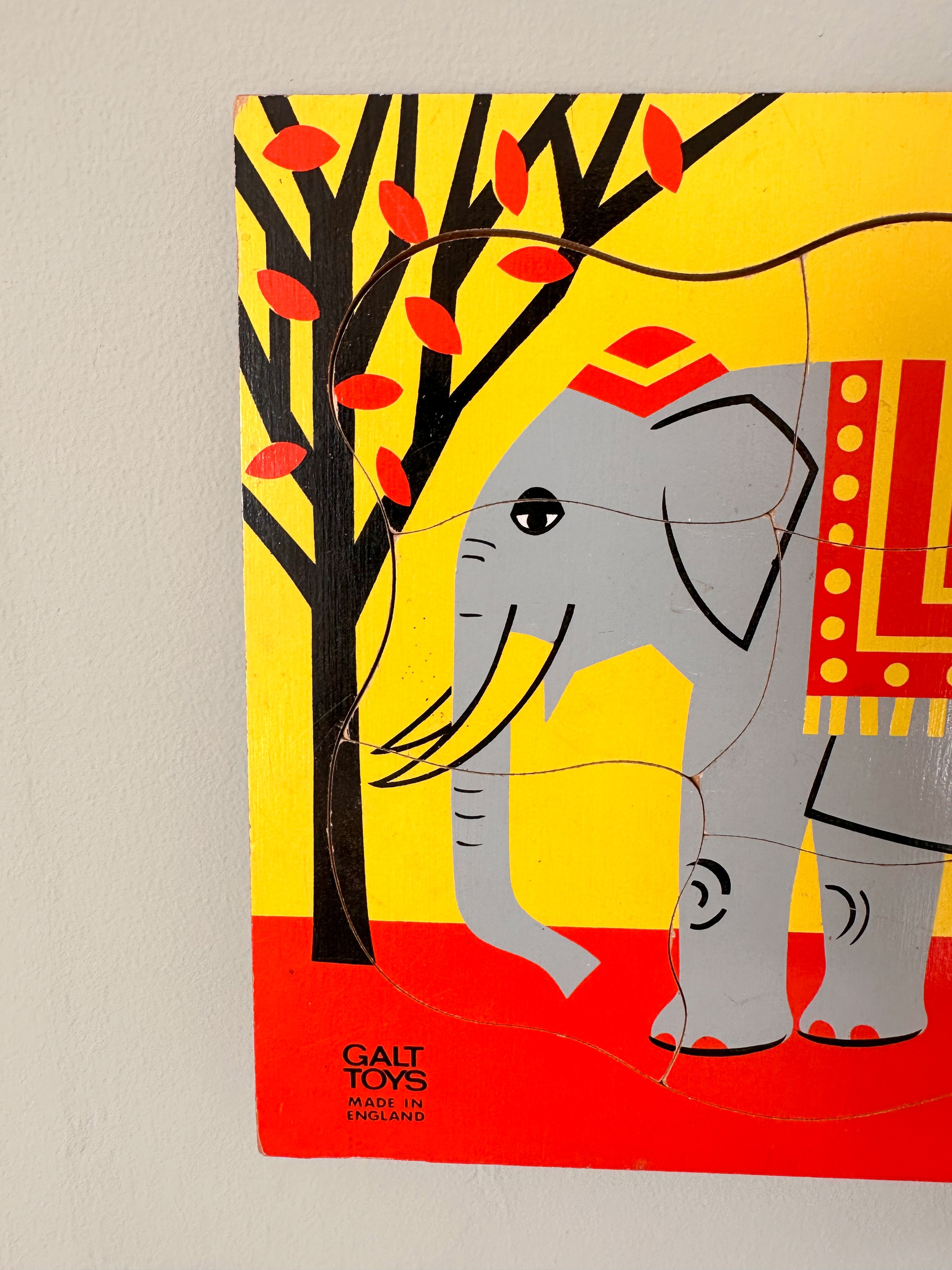 Vintage wooden elephant jigsaw puzzle, red and yellow, made in England by GALT - Moppet