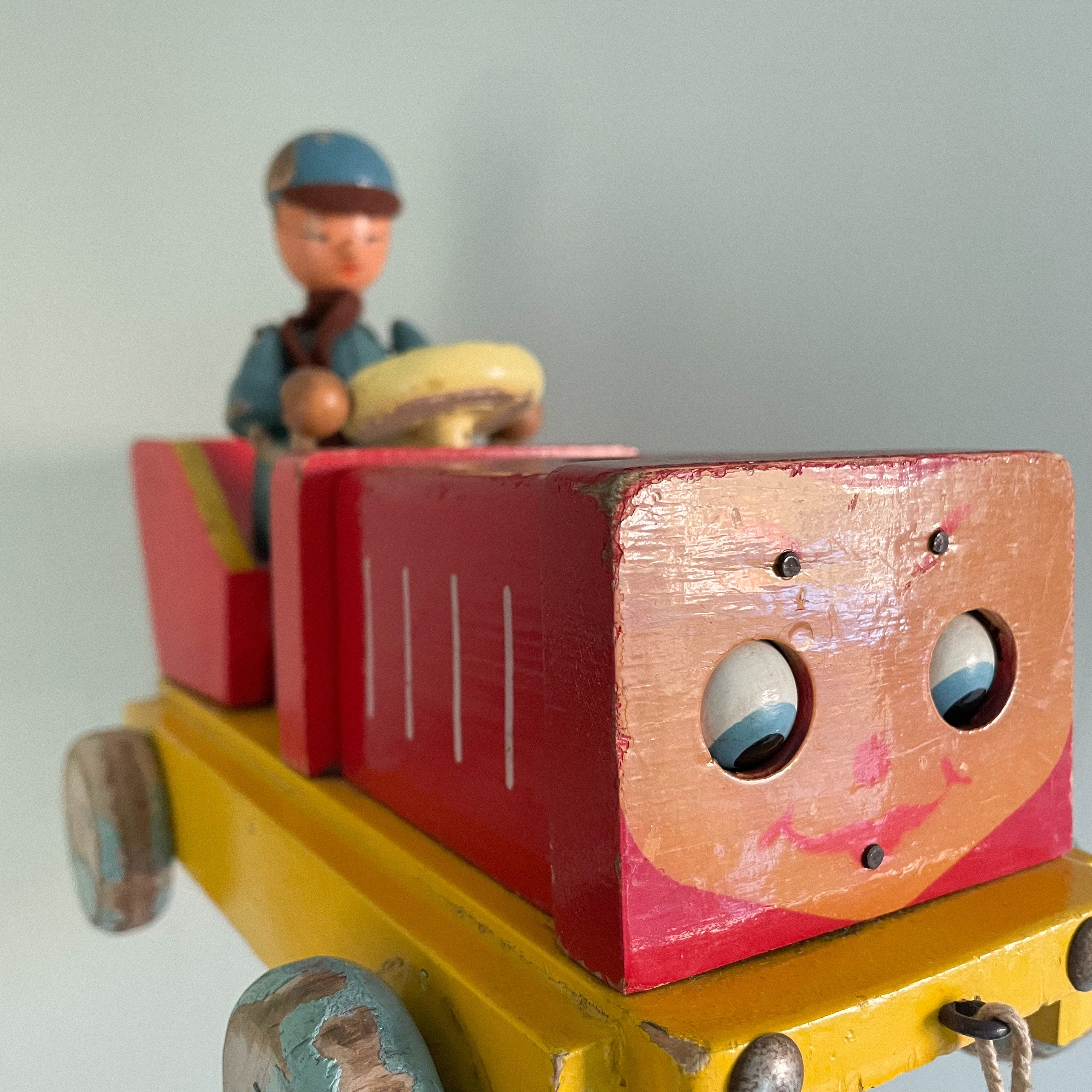Vintage wooden Czech red pull-along tractor with driver - Moppet