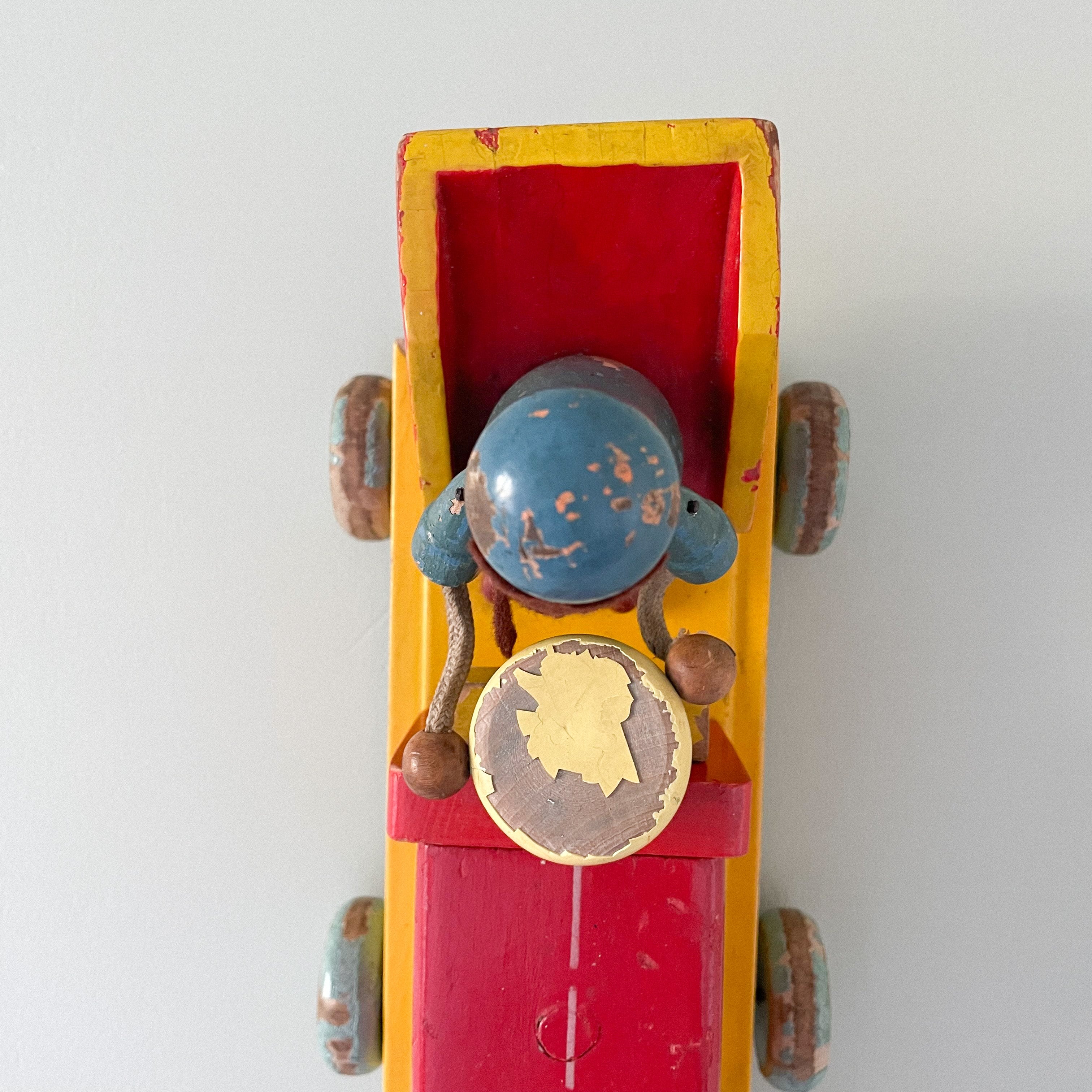 Vintage wooden Czech red pull-along tractor with driver - Moppet