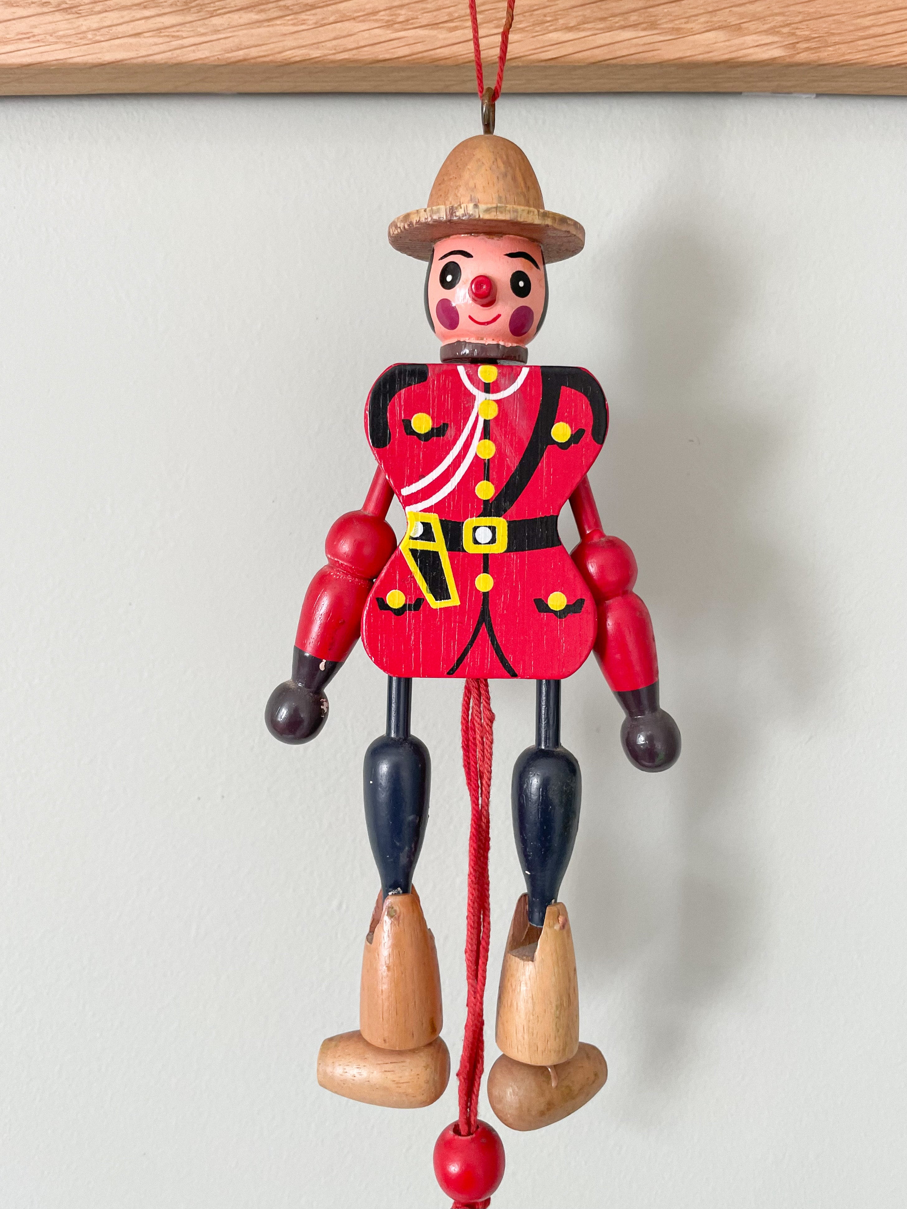 Vintage Canadian Mountie jumping-jack pull toy - Moppet