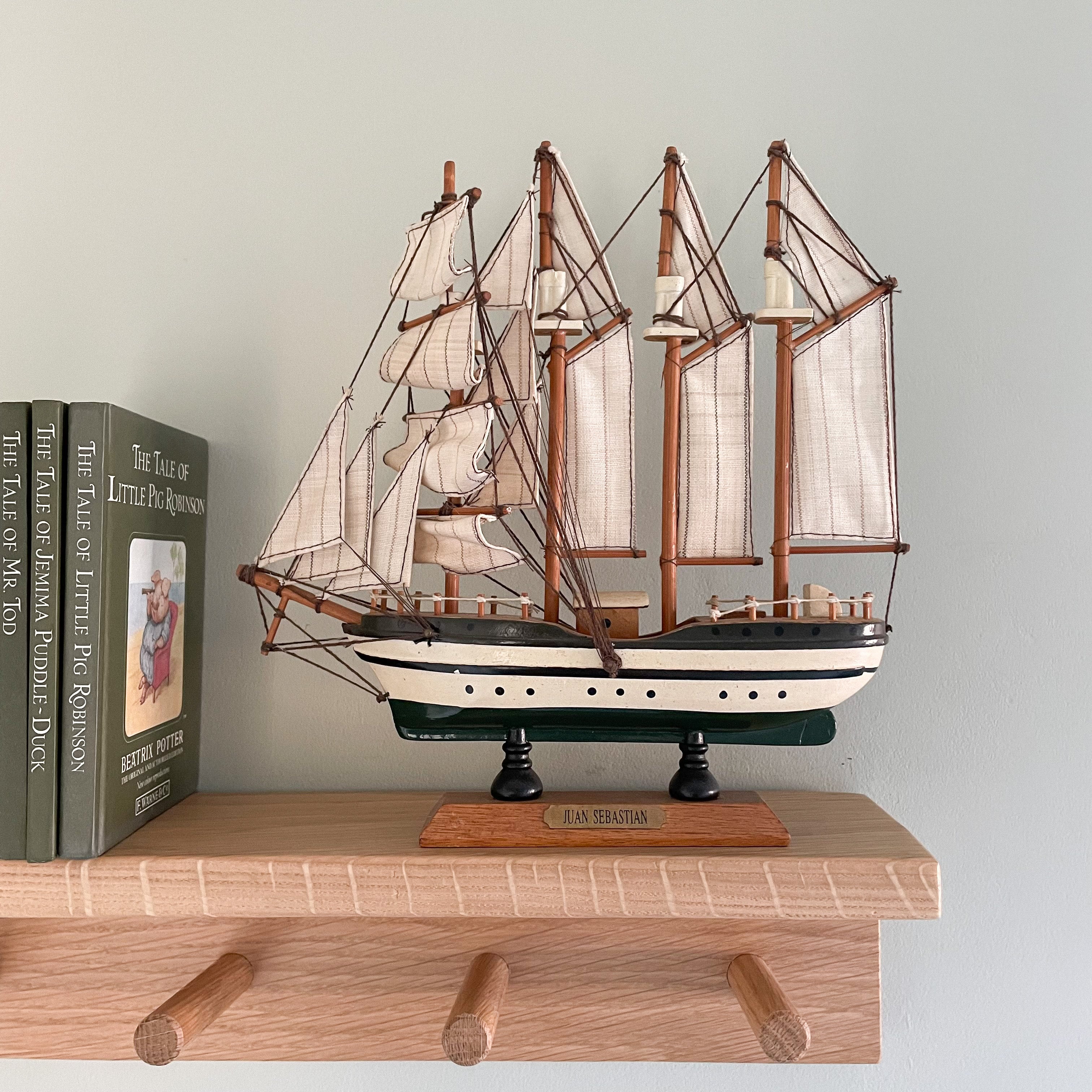 Vintage wooden model sailing ship in monochrome black and white, Juan Sebastian - Moppet