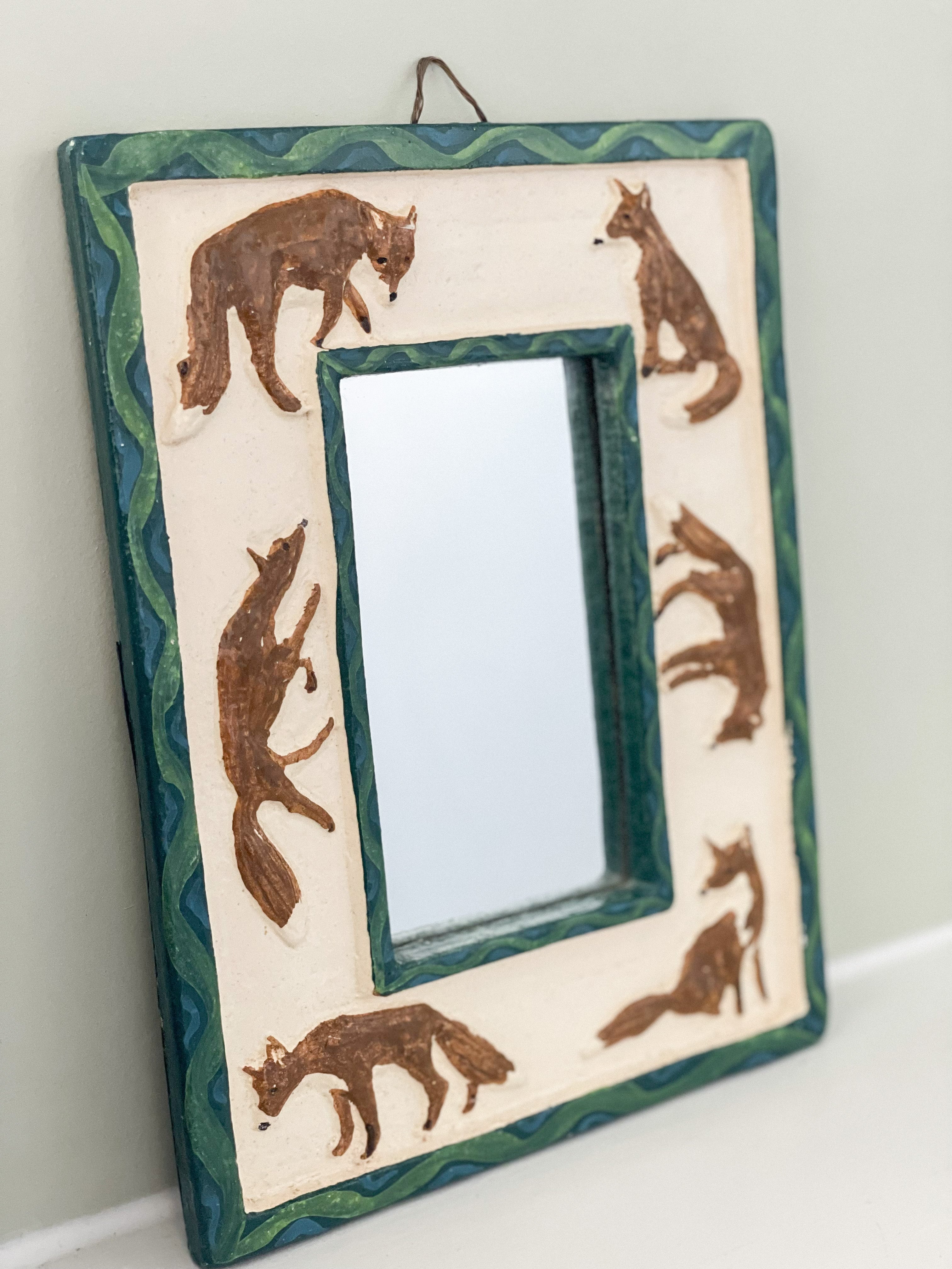Vintage handmade ceramic mirror featuring foxes in blue green and brown - Moppet