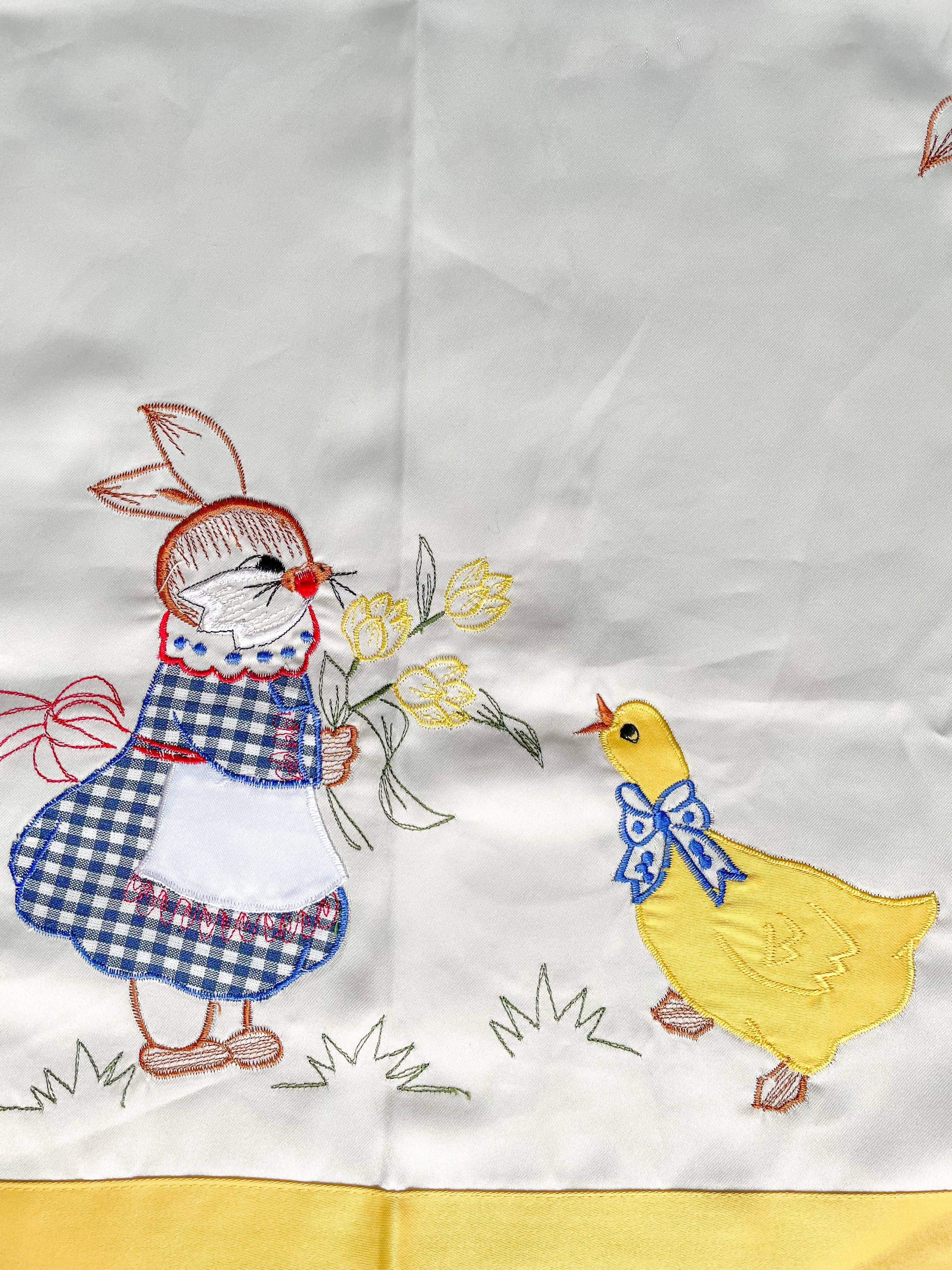 Vintage midcentury hand-embroidered satin Easter table cloth or centrepiece featuring rabbits and ducks in lemon yellow, white and blue - Moppet