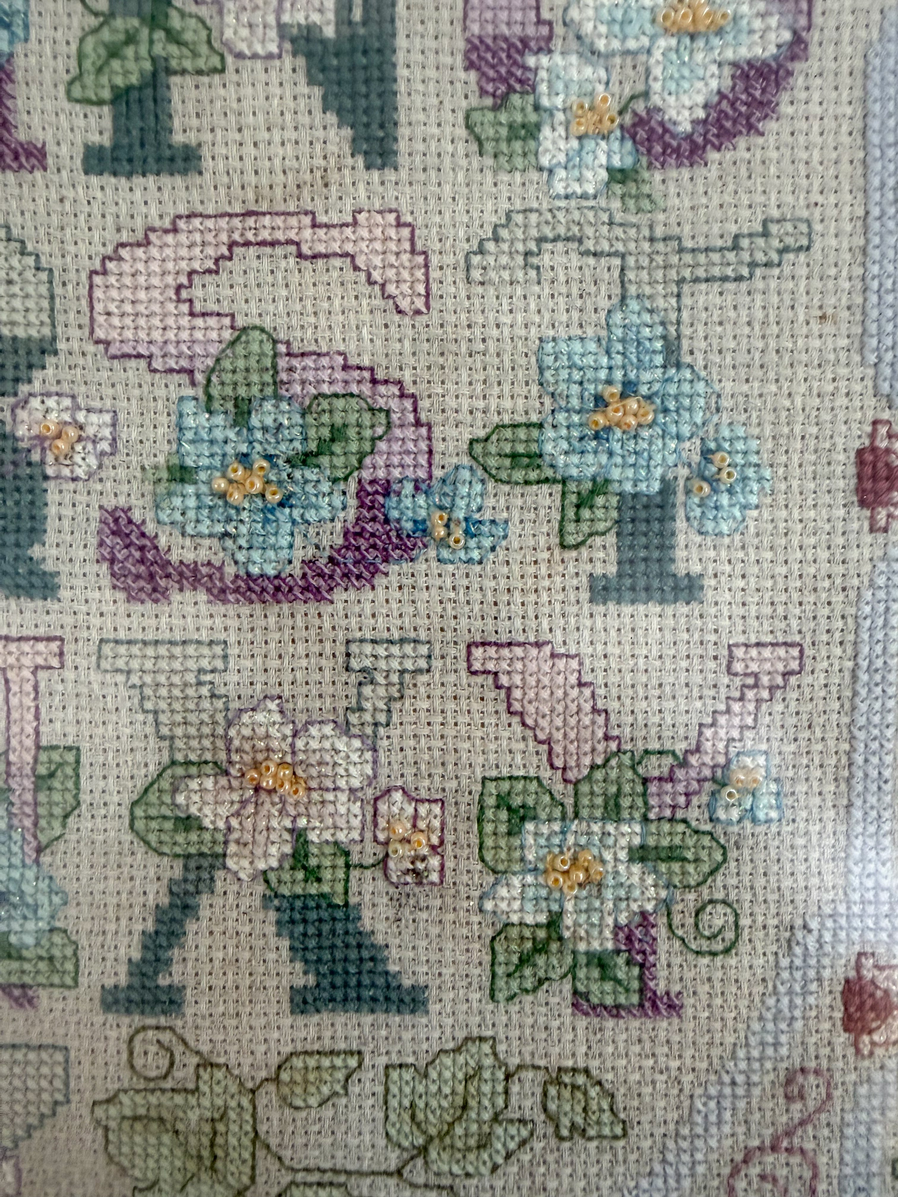 Vintage framed alphabet ABC floral cross stitch sampler in lilac and pastels