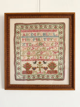 Load image into Gallery viewer, Antique framed alphabet cross stitch embroidery sampler, in blue, pink, green and yellow - Moppet
