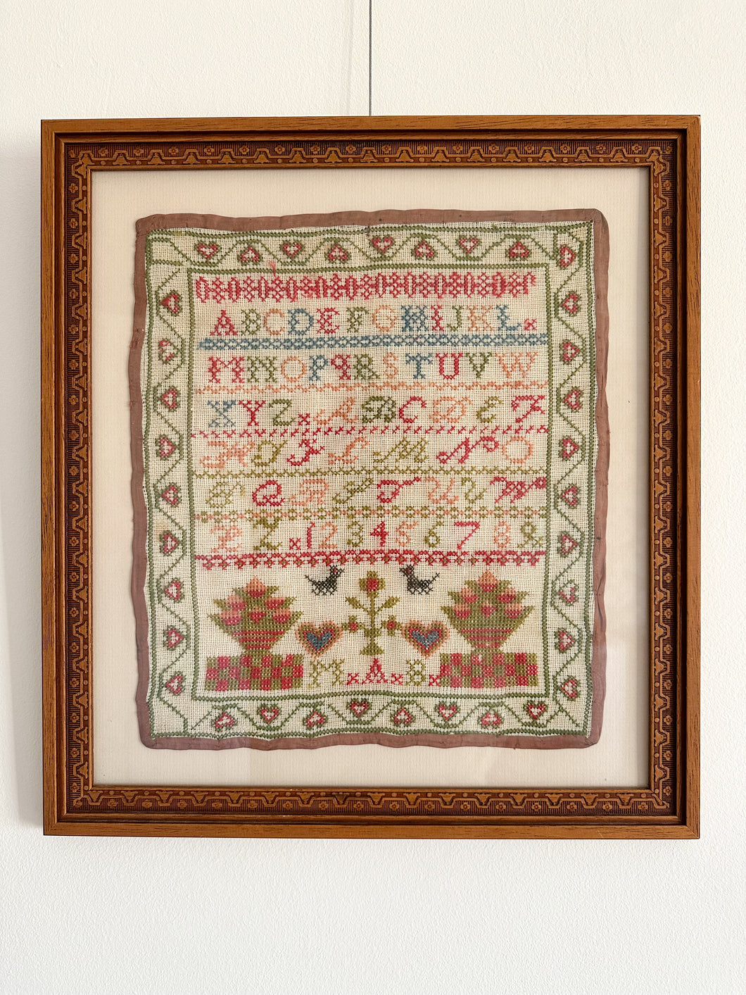 Antique framed alphabet cross stitch embroidery sampler, in blue, pink, green and yellow - Moppet