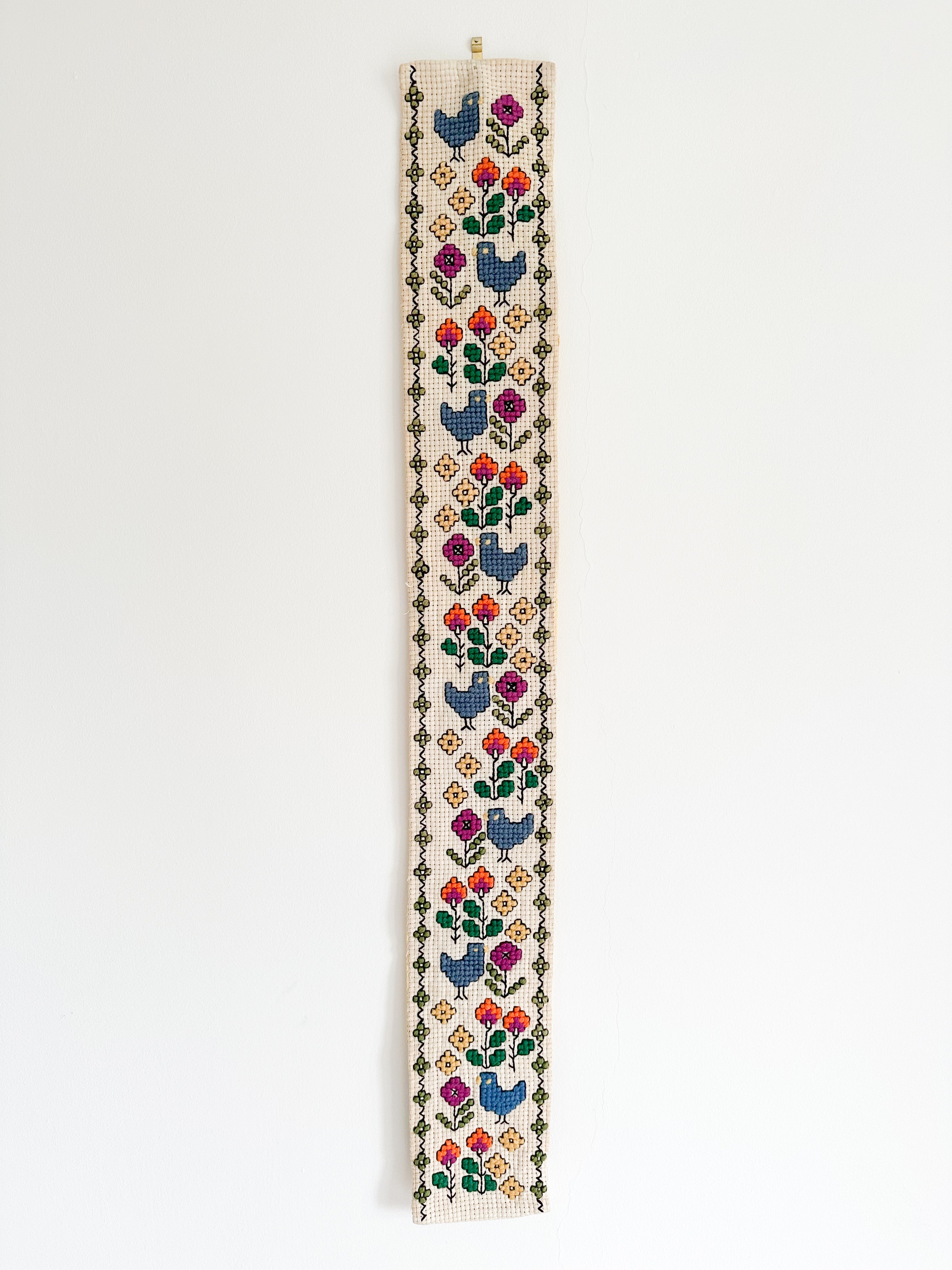 Vintage Scandinavian needlepoint embroidery wall hanging featuring birds and flowers, blue, yellow, purple and orange - Moppet