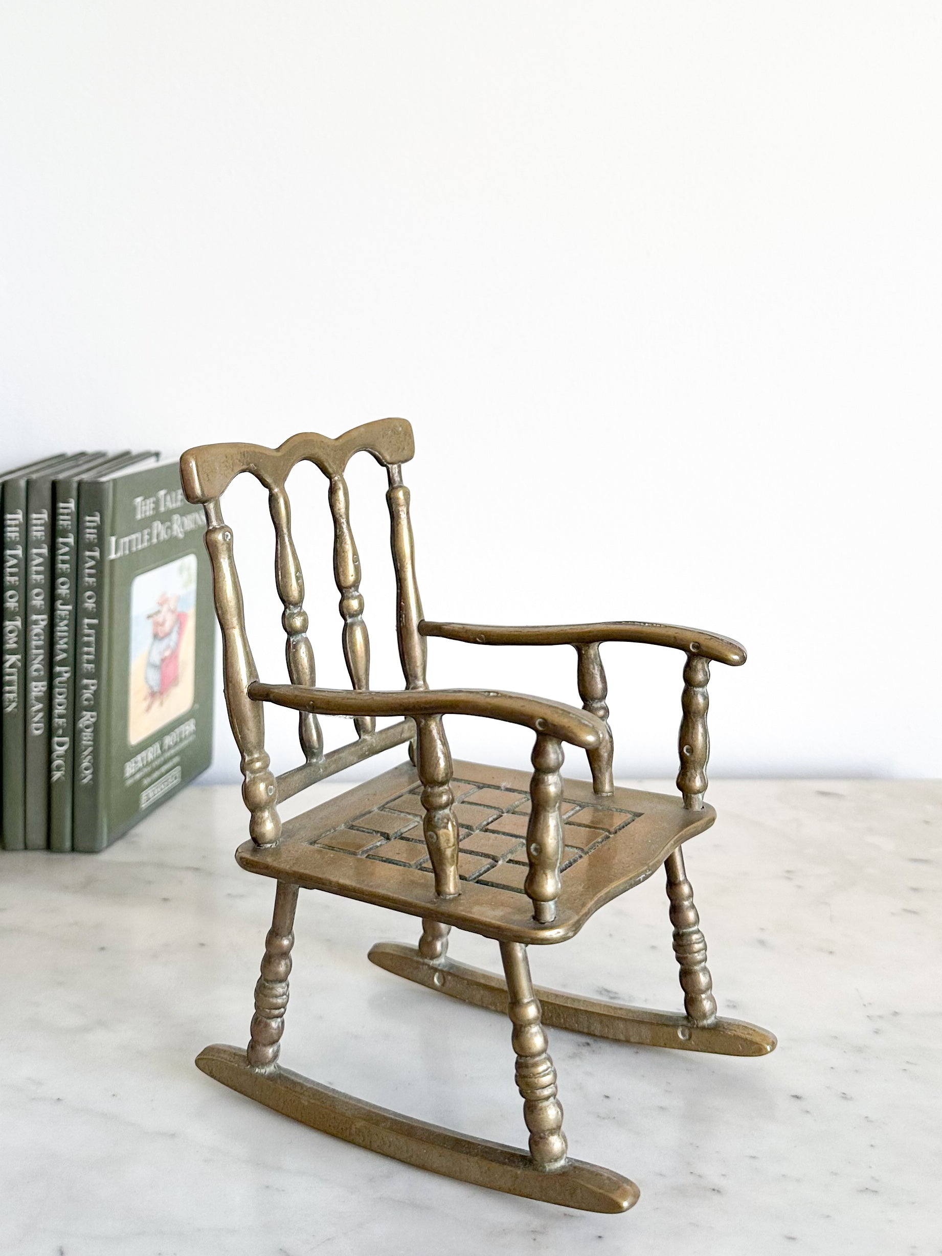 Vintage brass rocking chair