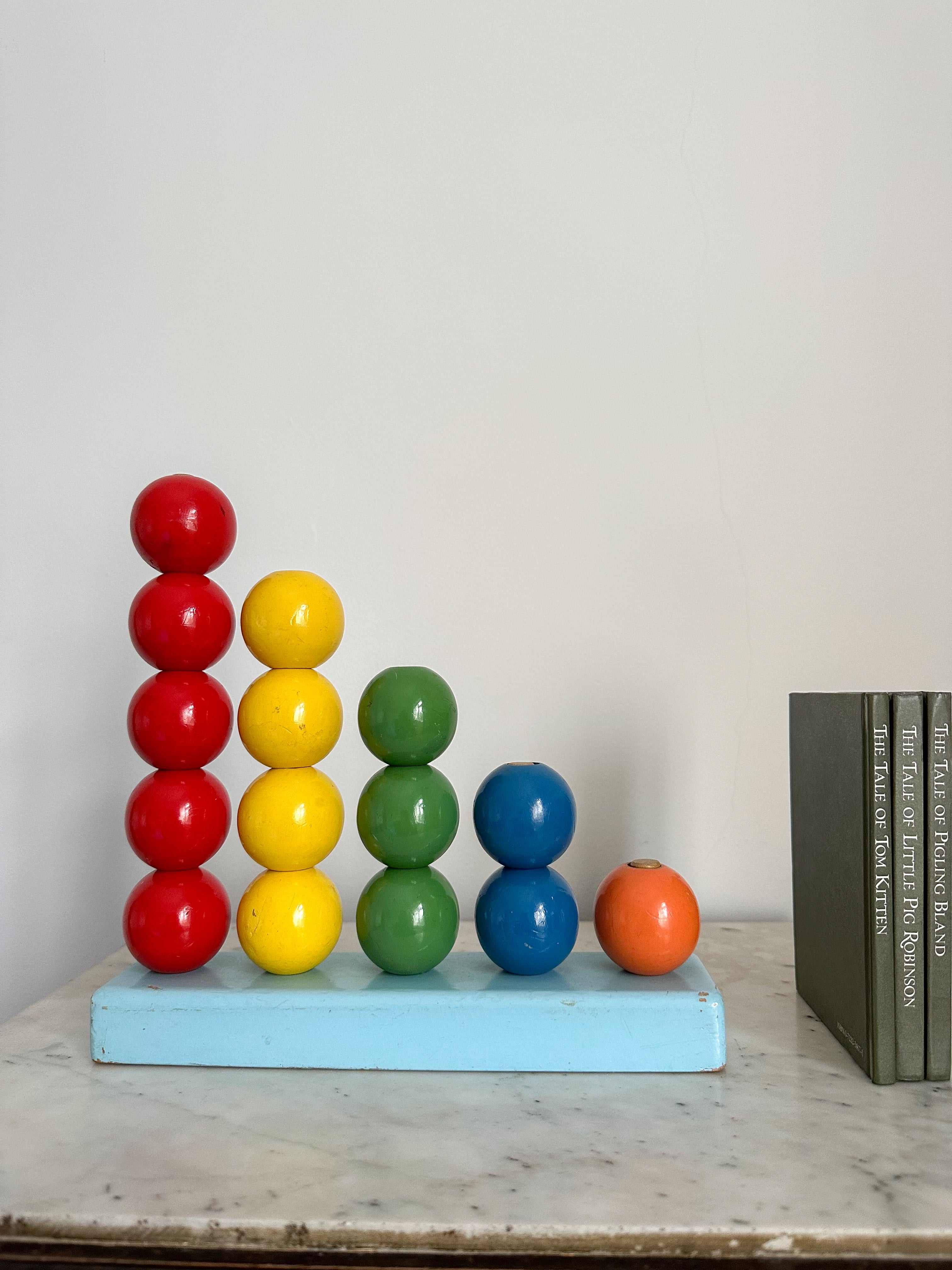Vintage 1950s Escor stacking counting toy in primary colours, British made - Moppet