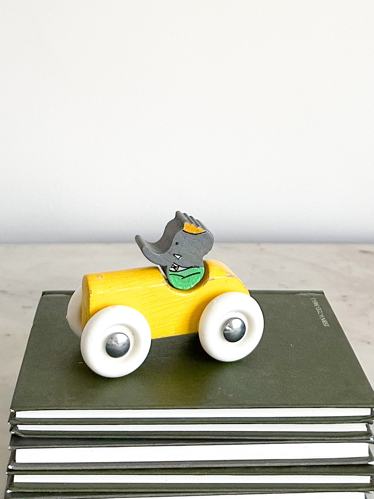 Vintage 1989 wooden Babar in car