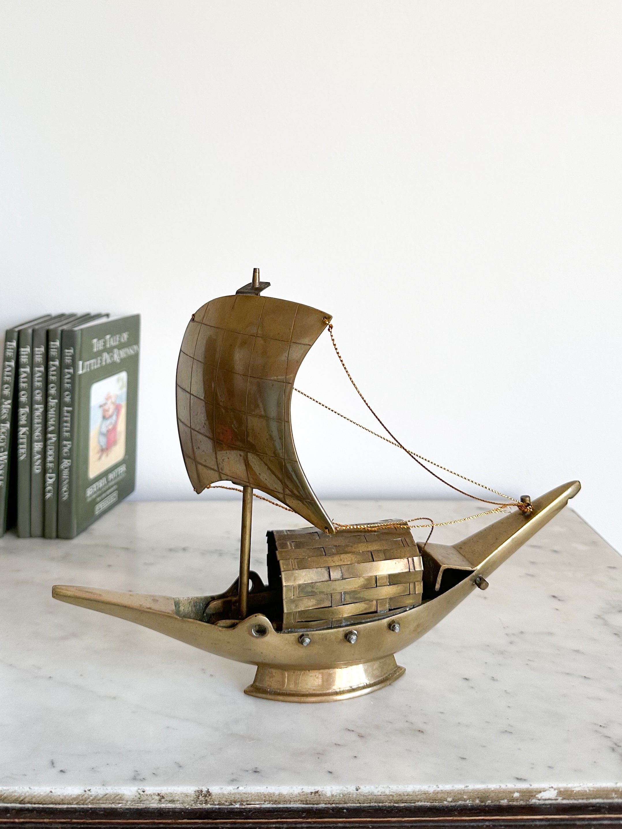 Vintage brass sailing boat