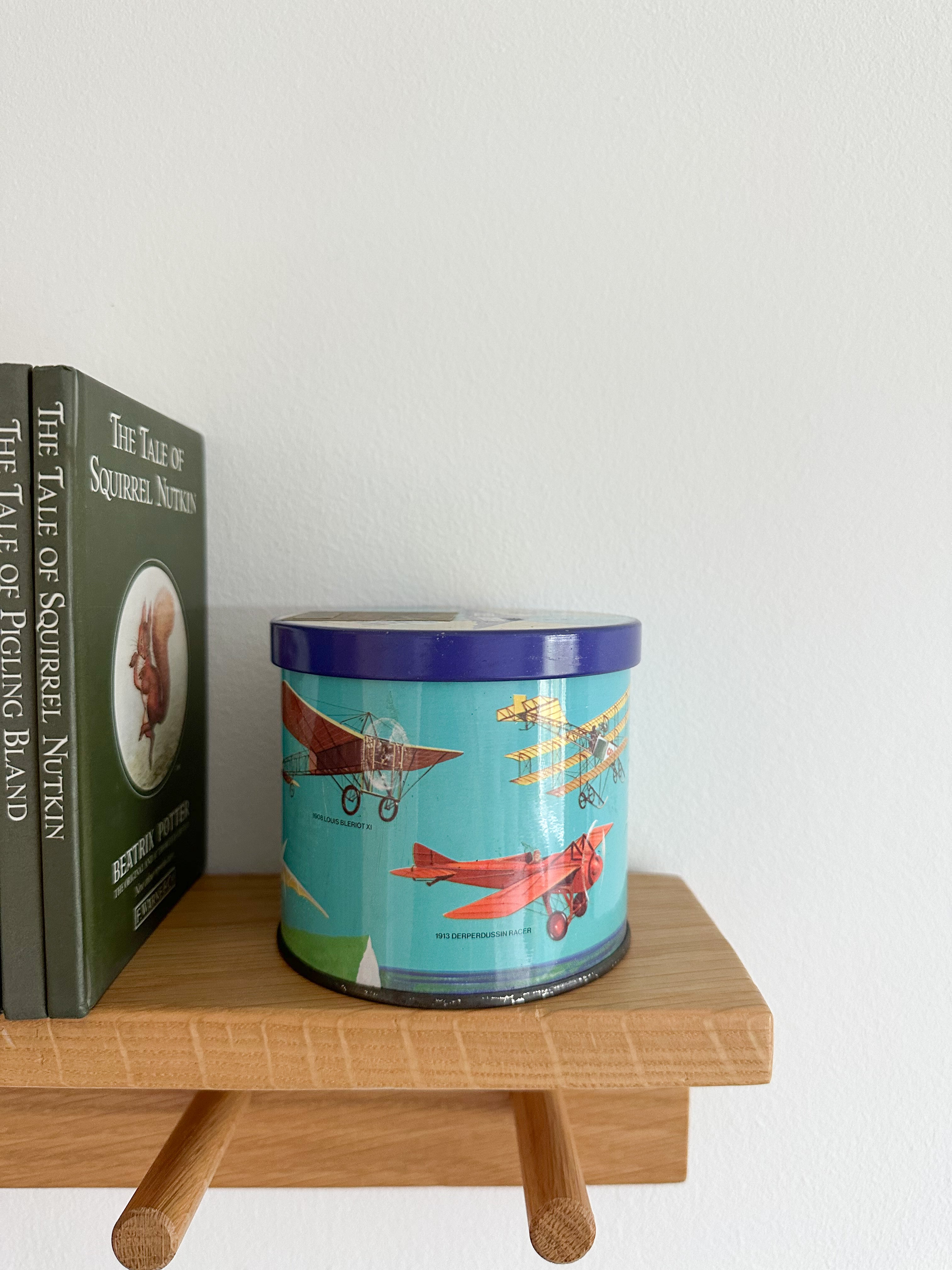 Vintage 1950s children’s illustrated graphic tin feat. aeroplanes, by Bluebird Toffee - Moppet