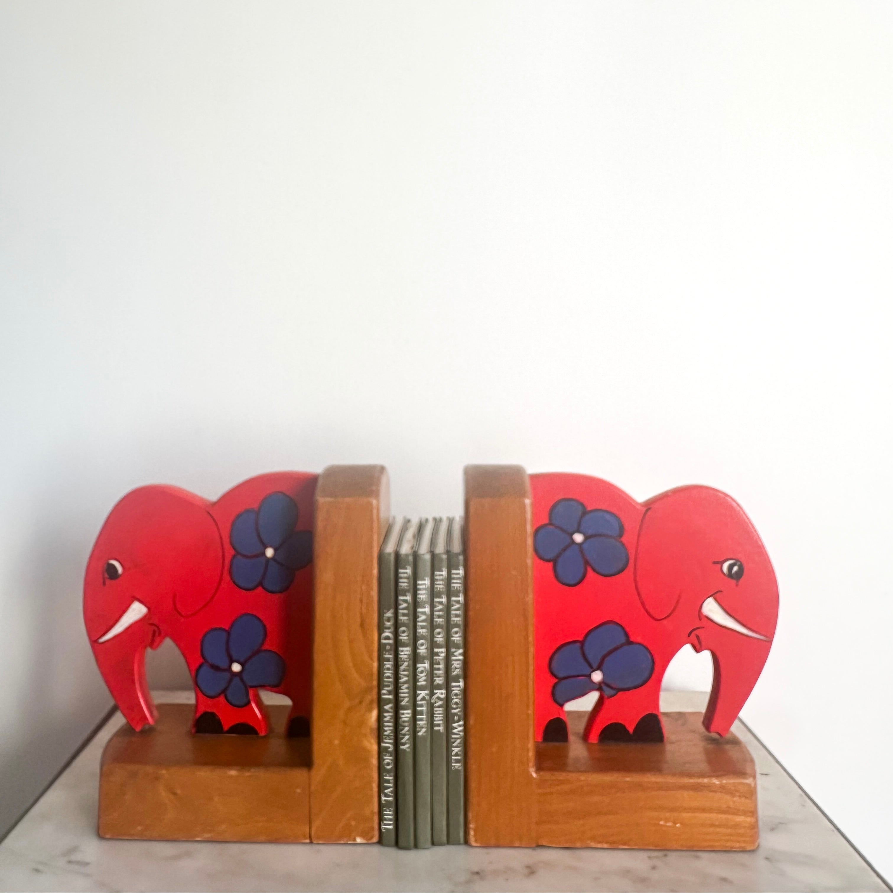 Pair of vintage handpainted wooden red elephant bookends