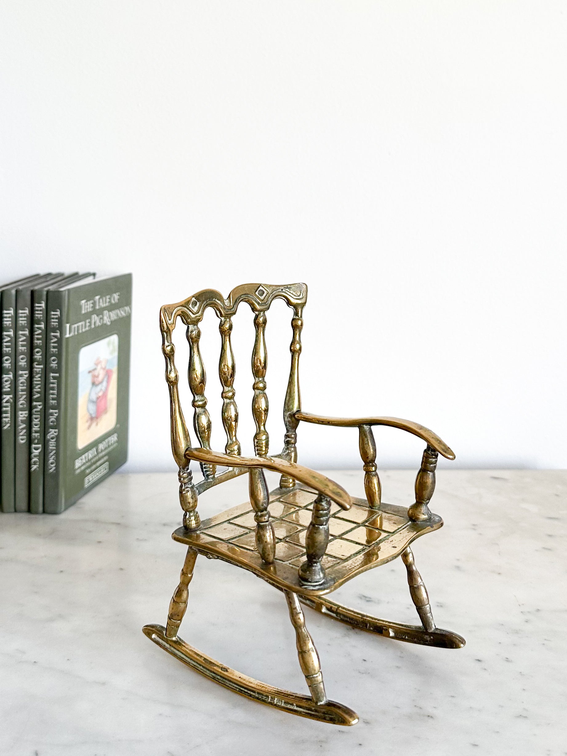 Vintage brass rocking chair