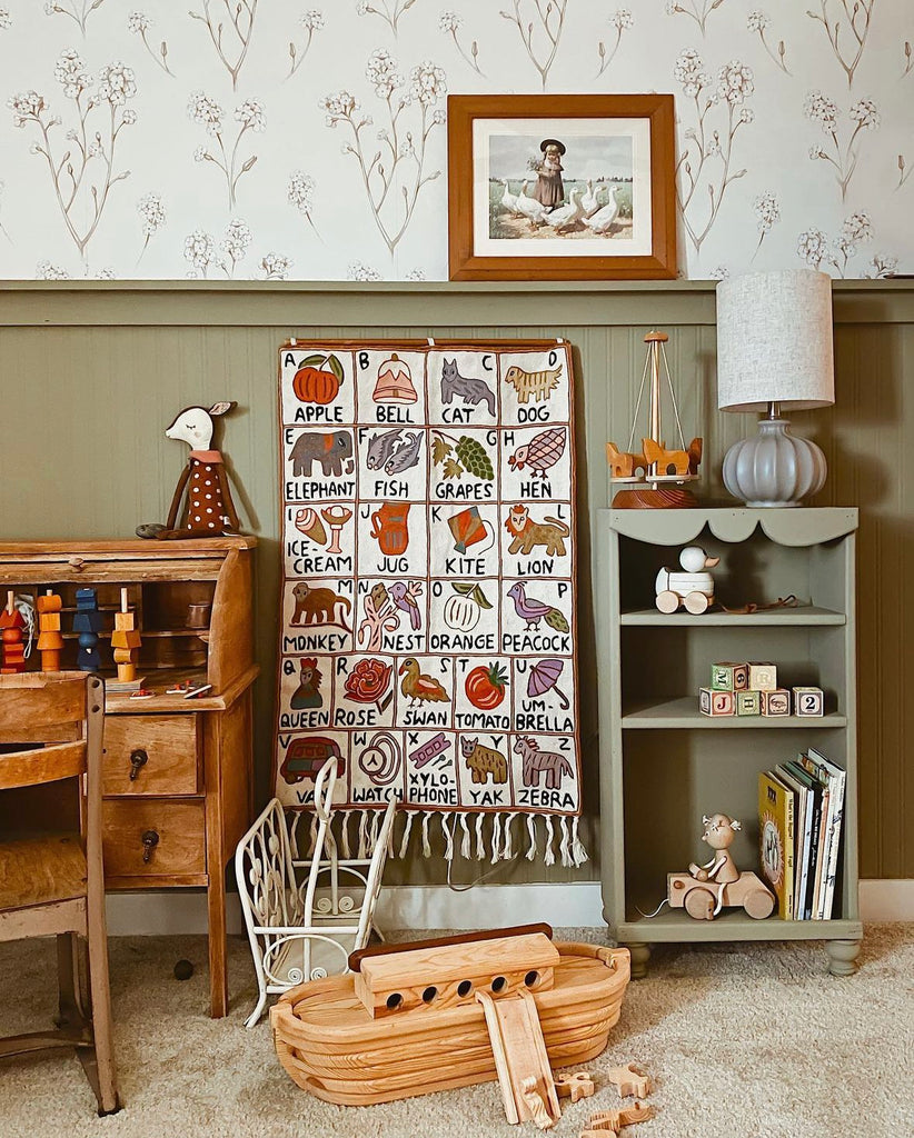 Moppet hand-embroidered ABC wall hanging in bedroom 