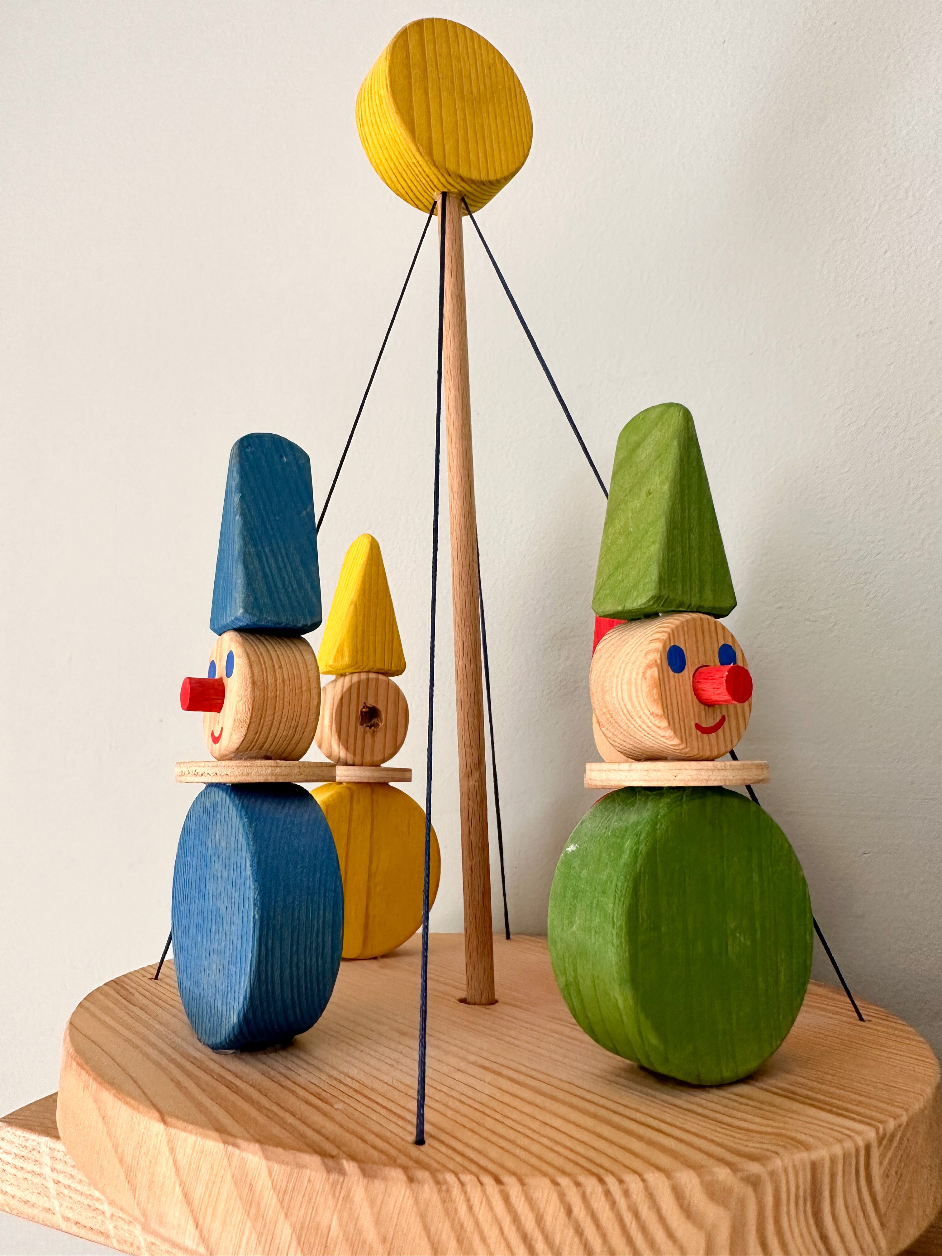 Vintage 1960s wooden hand-carved spinning clown carousel or merry-go-round - Moppet