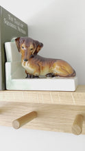 Load and play video in Gallery viewer, Rare vintage art deco ceramic dachshund/sausage dog bookend
