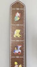 Load and play video in Gallery viewer, Vintage 1980s wooden German measuring stick or height chart, featuring a train, teddy bear and penguin, by Mertens Kunst
