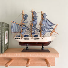 Load image into Gallery viewer, Vintage wooden model sailing ship with blue and white striped sails - Moppet
