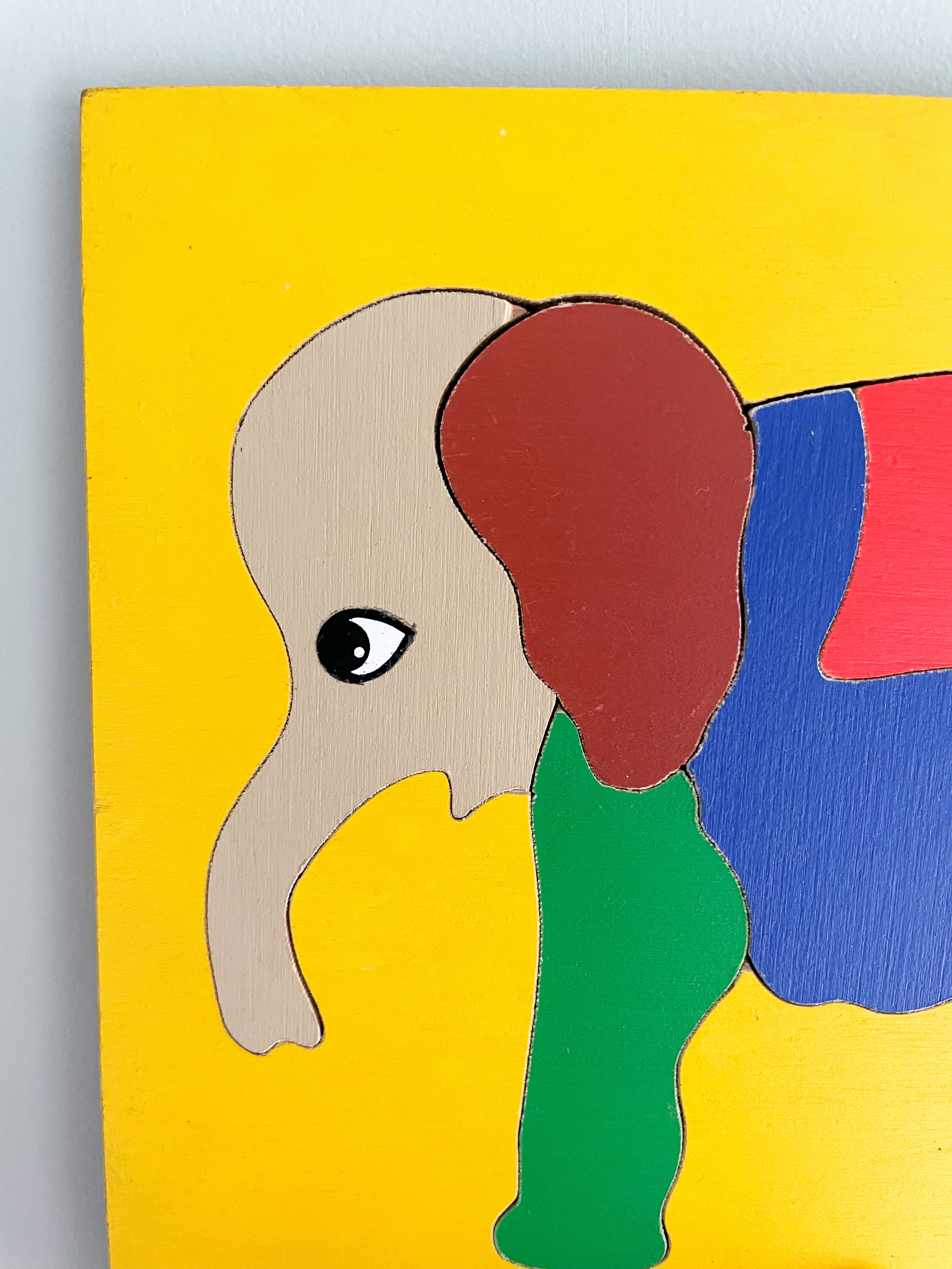 Vintage wooden jigsaw puzzle featuring an elephant in bright primary colours, by Willis Toys, made in England - Moppet