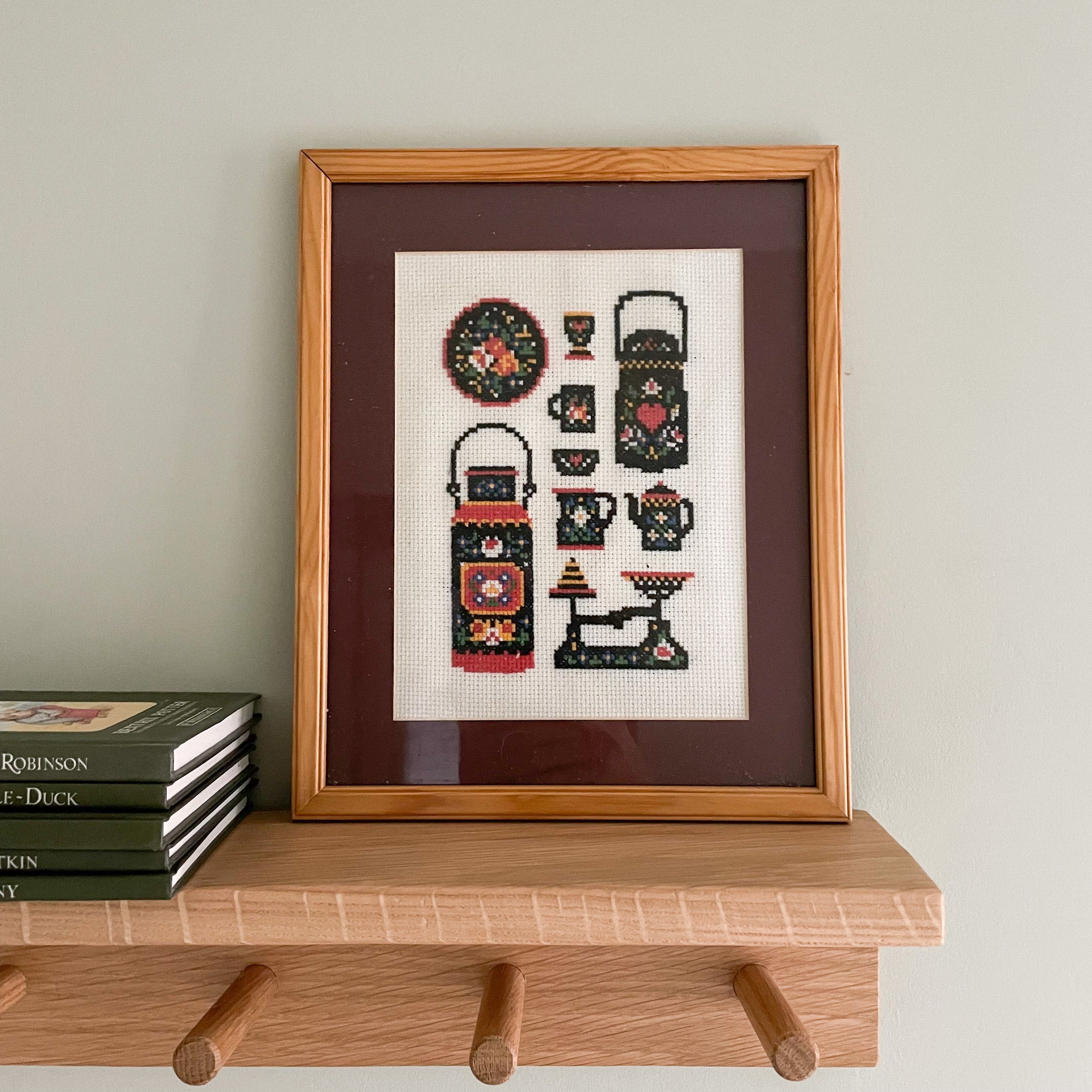 Vintage framed cross-stich embroidery or needlework of Scandinavian teapots, cups and kitchenware - Moppet