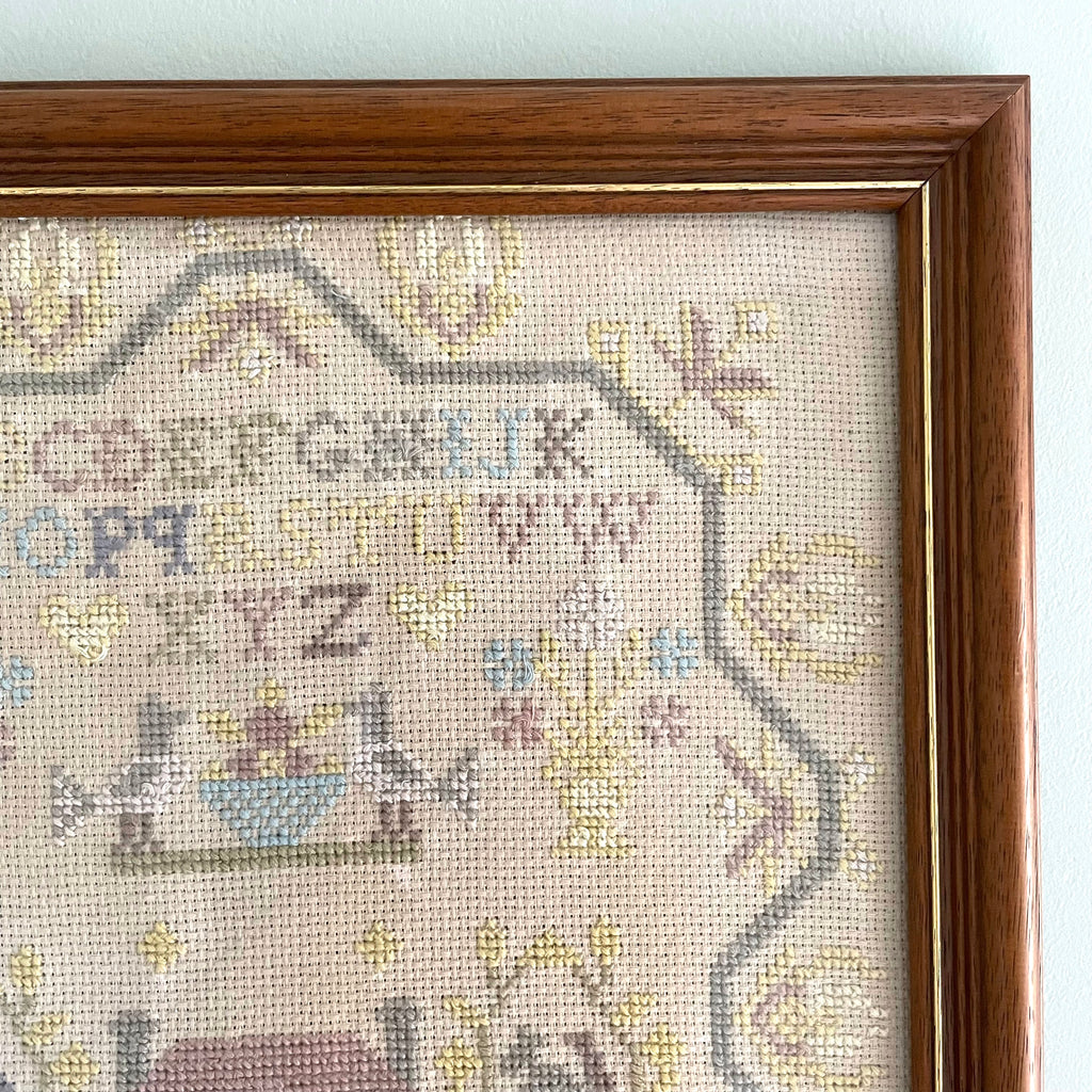 Vintage framed cross stitch sampler of a house, alphabet, numbers and flock of sheep - Moppet