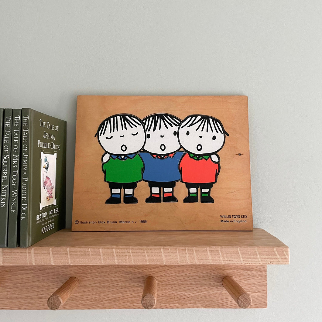 Vintage wooden jigsaw puzzle featuring three choir boys by Dick Bruna, dated 1969 - Moppet