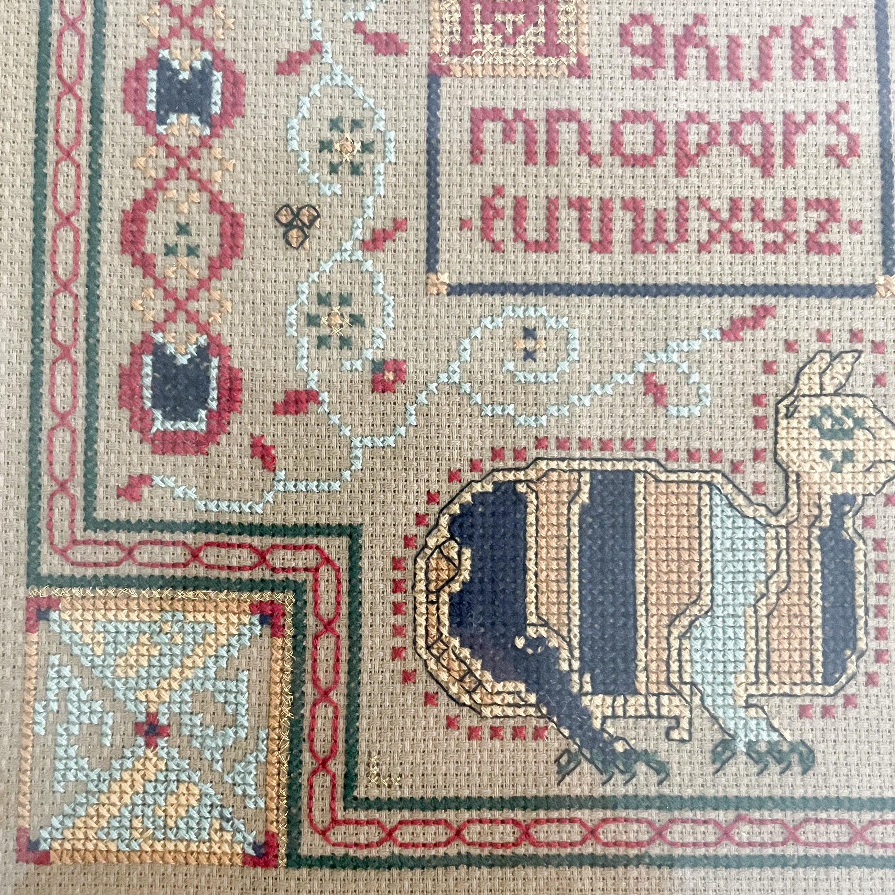 Vintage framed cross stitch embroidery of alphabet and cat - Moppet