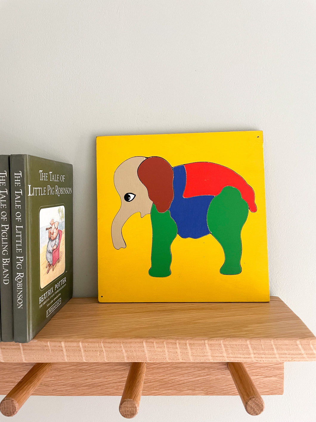 Vintage wooden jigsaw puzzle featuring an elephant in bright primary colours, by Willis Toys, made in England - Moppet