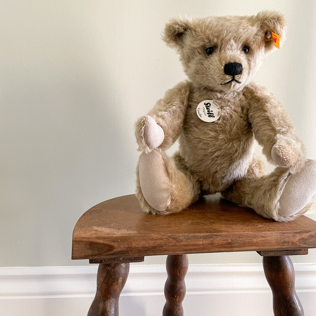 Vintage wooden French milking stool with three bobbin turned legs and a half-moon seat - Moppet