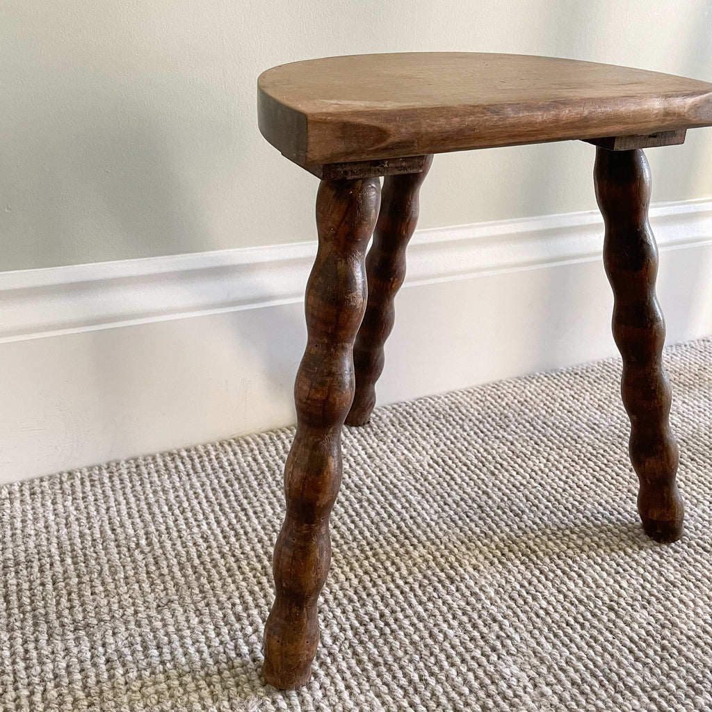 Vintage wooden French milking stool with three bobbin turned legs and a half-moon seat - Moppet