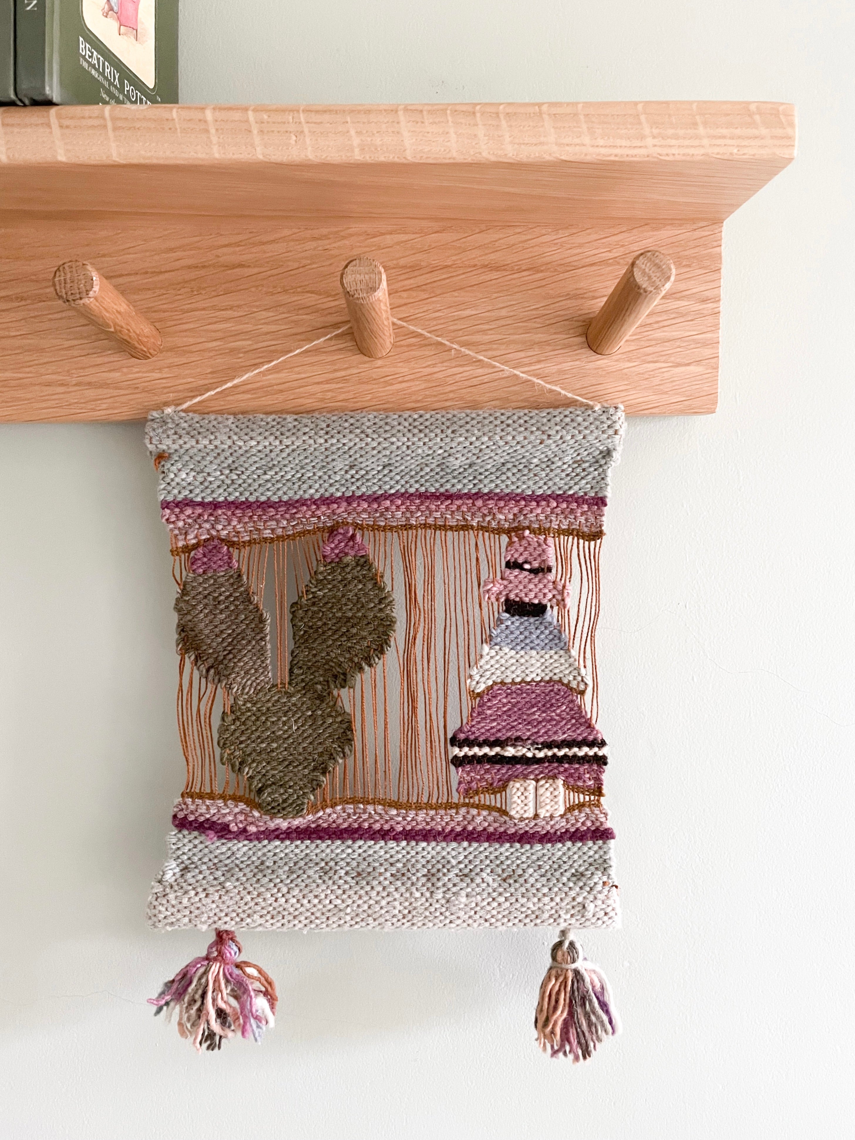Vintage handcrafted woollen wall hanging tapestry from Peru, woman with cactus in pinks, blue and green - Moppet