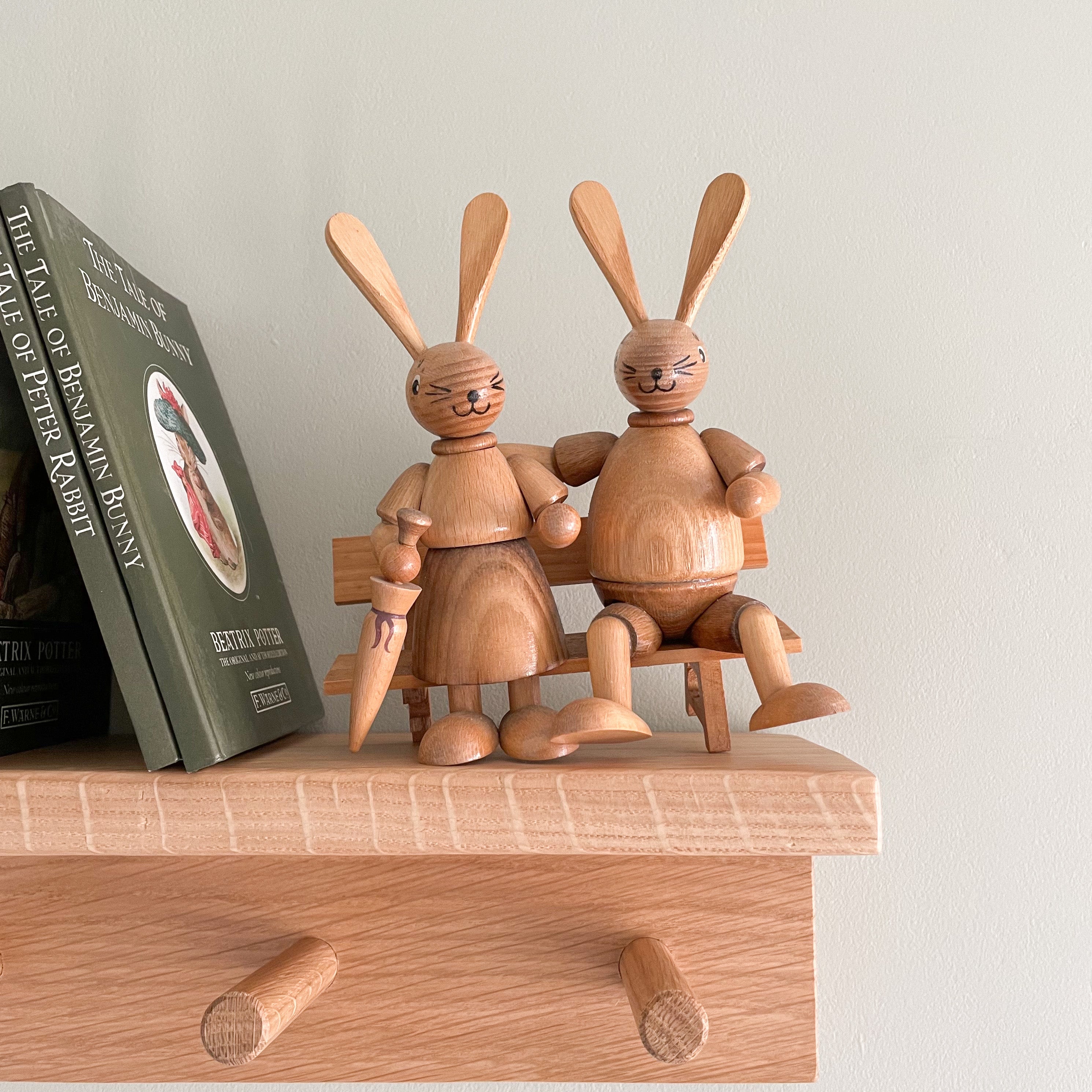 Vintage pair of wooden German bunny rabbits sat on a bench, by Erzgebirge Holzkunst DWU - Moppet