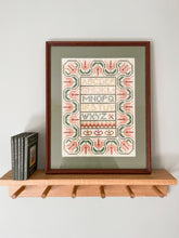 Load image into Gallery viewer, Vintage framed embroidery featuring an alphabet design in pastel colours with a green mount - Moppet
