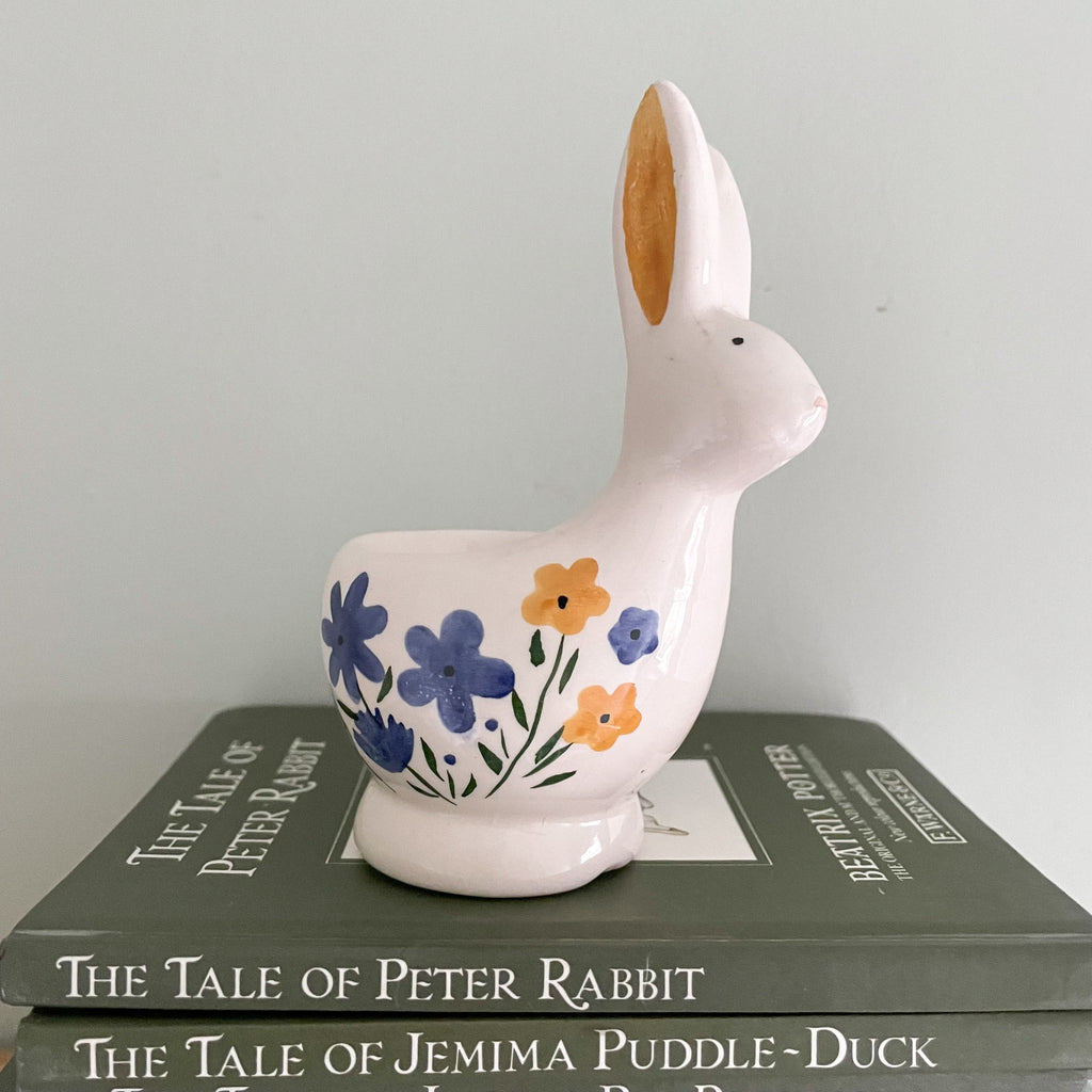 Vintage ceramic hand-painted Easter bunny rabbit egg cup with blue and yellow flower detail - Moppet