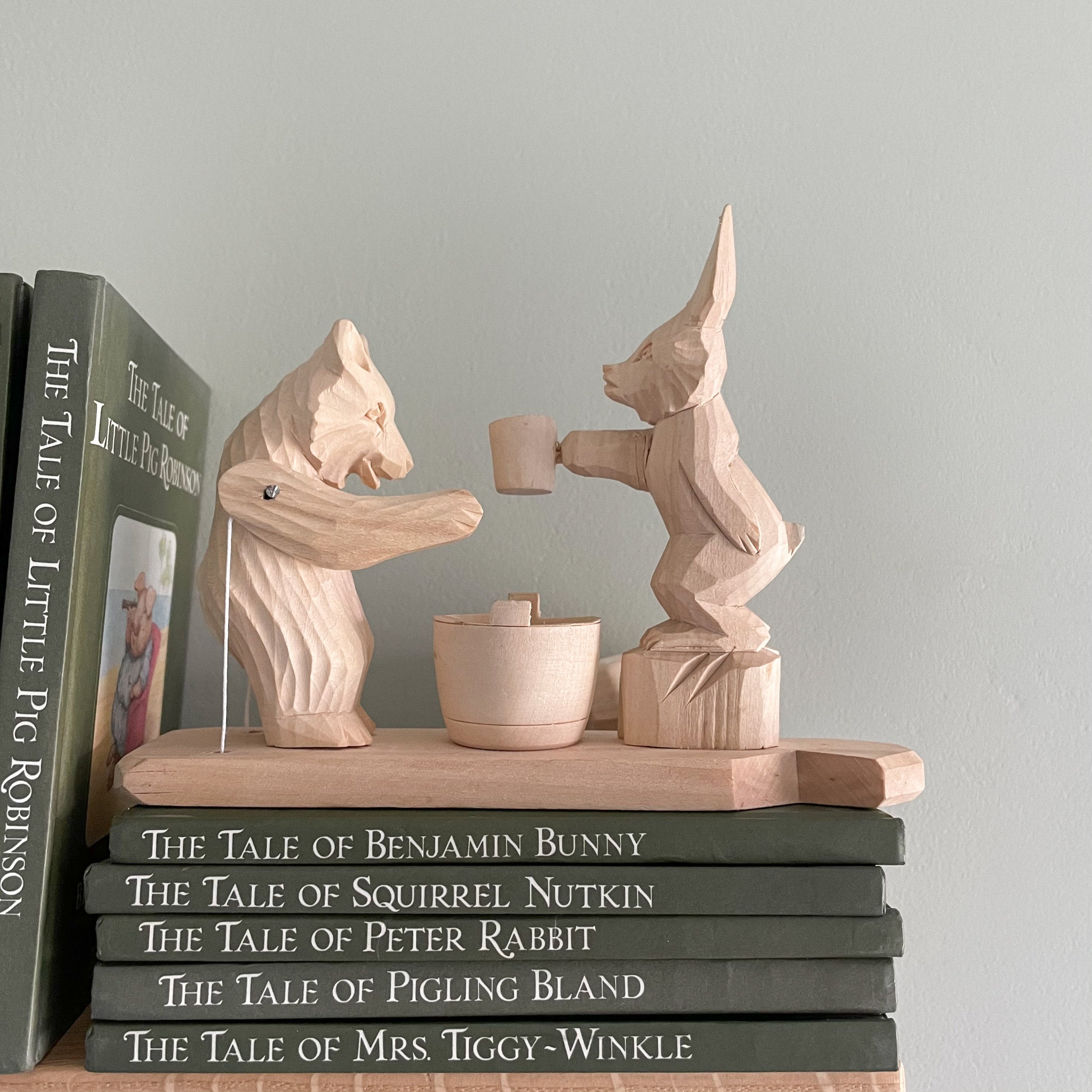 Hand-carved wooden traditional Russian folk toy featuring a rabbit and a bear - Moppet