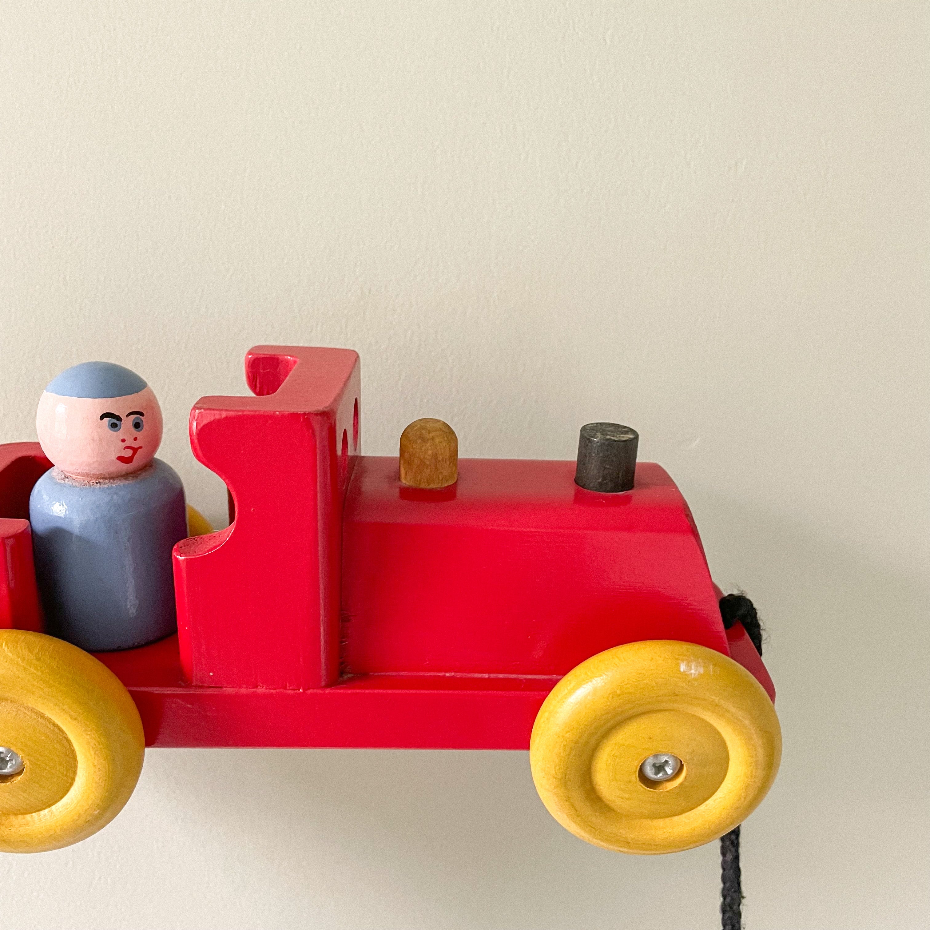 Vintage 1950s red wooden Escor train with peg-doll passenger, British made - Moppet